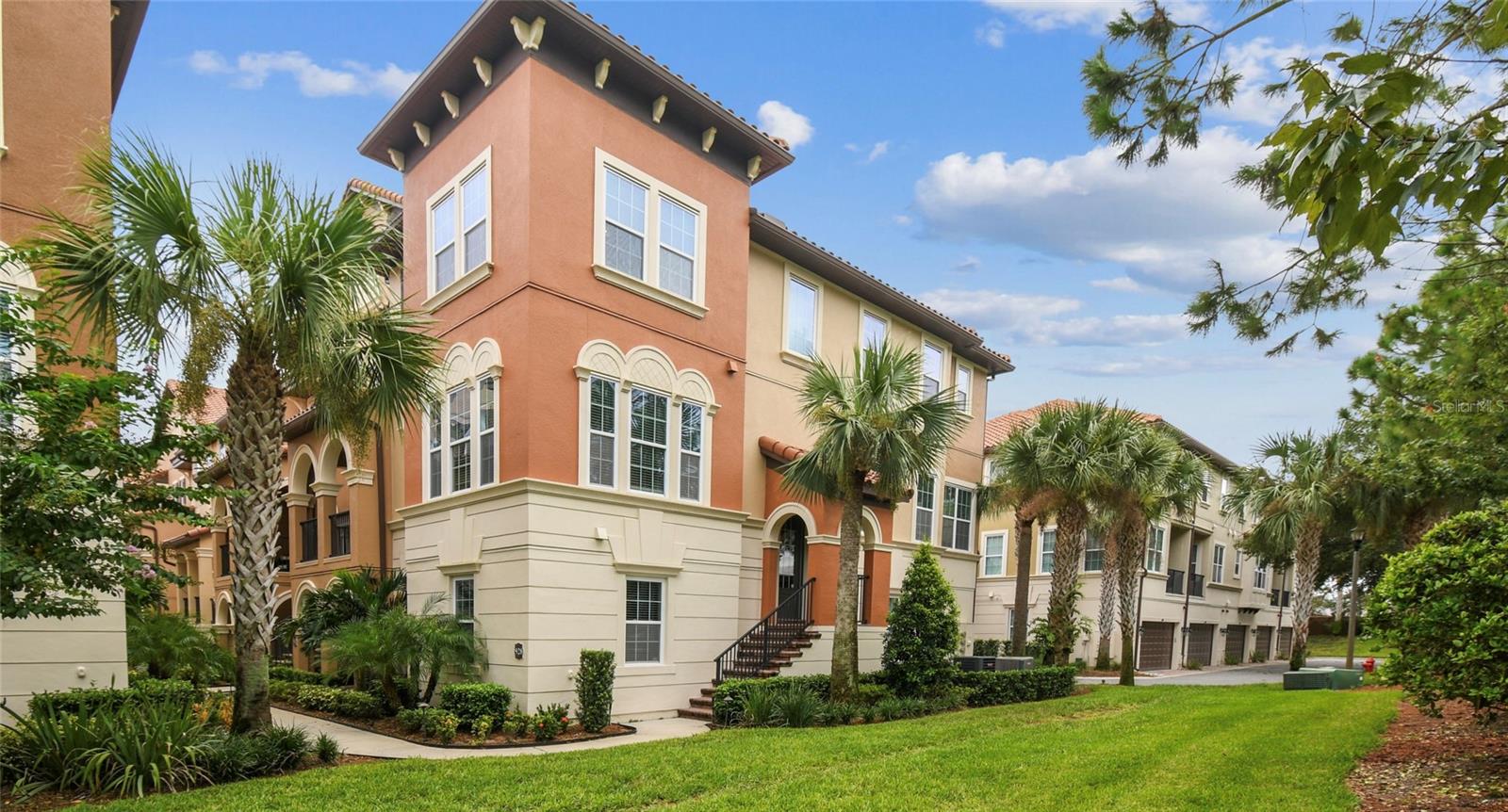 Beautiful 4-Bedroom, 3.5-Bath End-Unit Torino Model Townhome in the highly sought-after Fountain Parke community! Filled with natural light from multiple windows and soaring ceilings, this home offers an open and inviting layout across three spacious levels.The first floor provides a PRIVATE SUITE option with its own bedroom, walk-in closet, and full bath with walk-in shower—perfect for use as an in-law suite, media room, or private office. Two hallway closets, including one with deep storage, offer excellent organization.The second floor is the heart of the home, where the living room boasts striking WOOD BEAMS that enhance the grand feel of the space. The kitchen features newer stainless steel appliances, TALL cabinets, a stylish backsplash, GRANITE COUNTERS and a large closet pantry. An adjacent dining room makes entertaining easy, while the cozy sunroom/sitting area is perfect for relaxing with a cup of tea. Step out onto the newly SCREENED BALCONY off the kitchen to enjoy warm breezes. A convenient HALF BATH is also located on this level.The third floor hosts the spacious PRIMARY SUITE, featuring an ENSUITE BATH with a walk-in shower, DUAL SINKS with raised vanities, and a CUSTOM WALK-IN CLOSET with built-ins. Two additional bedrooms with cozy carpet share a Jack-and-Jill bath. A versatile loft area, currently used as an office, adds extra living space. For convenience, the laundry closet is also located upstairs and includes a newer washer and dryer.The two-car garage includes OVERHEAD STORAGE RACKS, providing even more usable space. WHOLE HOUSE WATER SOFTENER ensures clean, soft water for all. Fountain Parke is a 24-hour guard-gated community offering resort-style amenities, including a clubhouse, fitness center, pool, tennis and pickleball courts, playground, and dog park. Conveniently located near Downtown Lake Mary, you’ll have easy access to shopping, dining, grocery stores, and major highways, including I-4 and SR 417.This townhome offers the perfect balance of comfort and convenience in the heart of Lake Mary—schedule your private tour today!