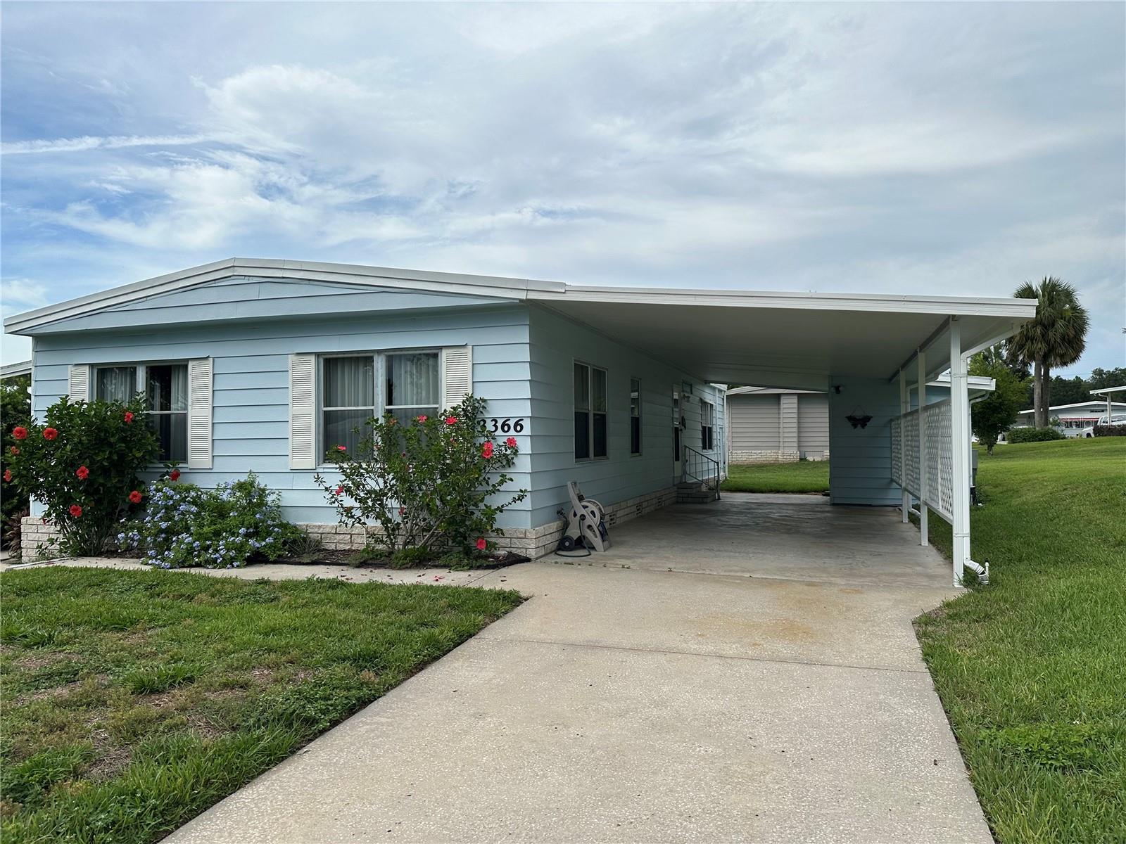 55+ Gated golf course community. Well maintained 2 bedroom 2 bath home located on a quite cut-de sac. New Hvac and new roof in 2025. Laminate flooring throughout. Finished laundry room. Home needs some updating but Best of all you " OWN THE LAND" This home is priced to sell so don't let the opportunity pass by Zellwood Station is located approximately 25 miles north of Orlando the entrance to the 429 western expressway is located just a short distance from Zellwood Stations entrance. This allows fro easy access to downtown Orlando the international airport and all the area attractions.