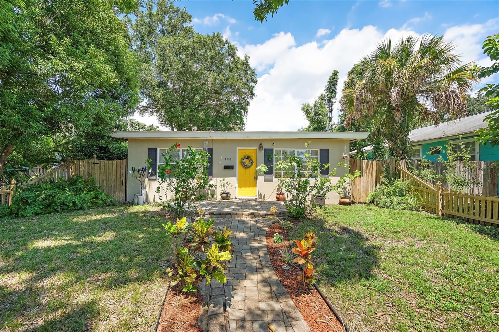 Charming 2-bedroom, 1-bath single-family home in the heart of St. Petersburg and located in a no flood zone. Step inside to a bright, inviting living area with large windows, tile flooring throughout, and cheerful finishes. The kitchen features stainless steel appliances, ceramic tile countertops, a stylish backsplash, and ample cabinet storage. Both bedrooms are well-sized with closet space, and the bathroom features clean tile finishes.
Out back, enjoy a spacious fenced yard shaded by mature trees — ideal for entertaining, gardening, or pets. With alley access, this property is perfect for anyone needing extra space for an RV, boat, or additional parking. The home also includes a covered carport plus an attached one-car garage that doubles as laundry, storage, or workshop space.
Offering comfort, functionality, and plenty of outdoor space, this home delivers unbeatable versatility and a central location near Downtown, the beaches, and local parks — all without flood insurance requirements. Don’t miss this opportunity!