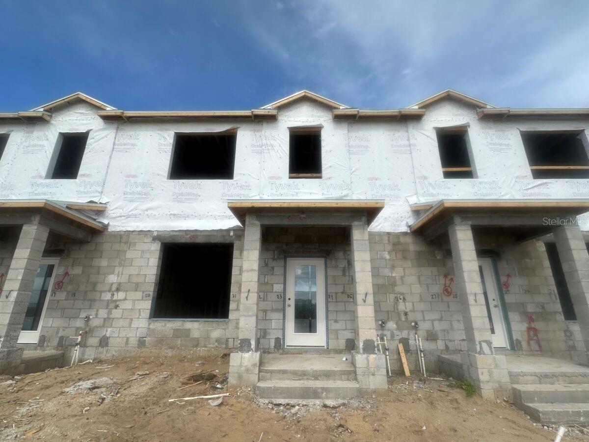 Under Construction. Discover this stunning new construction townhome at 9416 Bolshoi Alley in Winter Garden. This charming home features 3 spacious bedrooms, 2.5 bathrooms, an open-concept living area, and so much more. This home showcases excellent design quality with attention to detail in every room. The open-concept floorplan connects the main living areas, creating an inviting atmosphere for daily life. The upstairs owner's bedroom provides a private retreat, while the additional bedrooms offer flexibility for family, guests, or home office space. Winter Garden offers an excellent neighborhood setting with proximity to beautiful parks and recreational opportunities. The area provides convenient access to shopping, dining, and entertainment while maintaining a peaceful residential atmosphere. This home represents an exceptional opportunity to own a brand-new home with no previous owners, allowing you to be the first to create memories in this beautiful space.