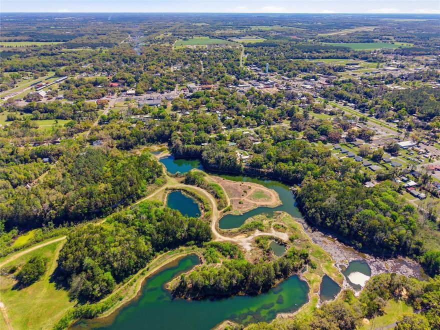 26.76± Acres Inside Williston City Limits – Prime Investment & Development Opportunity. Rare opportunity to acquire approximately 26.76± acres of vacant land located within the city limits of Williston at 1041 NE 6th Blvd, with the property consisting of four separate tracts of land (not all contiguous), offering flexibility for a variety of potential uses. This unique property presents an excellent opportunity for developers, investors, or end users seeking a large acreage position within a growing North Central Florida market. Ideally located just minutes from downtown Williston, the property provides convenient access to schools, shopping, and major roadways while maintaining the privacy and open space of a larger land holding. Positioned within a short drive to Ocala and Gainesville, the location supports long-term growth and access to regional amenities, employment centers, and outdoor recreation. The existing parcel configuration allows for potential phased use, resale, or strategic investment (subject to local approvals). Buyer to verify zoning, land use, and development potential with the City of Williston.