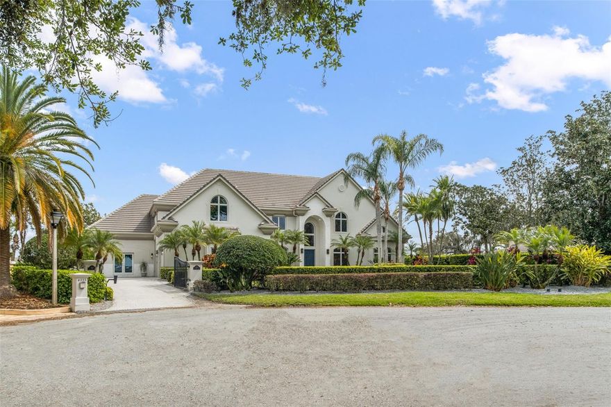 MAJOR PRICE REDUCTION! Incredible value!! Stunning LAKEFRONT estate on LAKE DOWN connected to the BUTLER CHAIN OF LAKES! Welcome to the cozy, quaint subdivision of Sunset Bay, all unique custom-built homes, located directly across the street from Isleworth Golf & Country Club affording you the conveniences of private golf membership opportunities nearby while residing in a community with NO HOA. This nearly 6,500 SF, 6 BR, 6.5 Bath, 3-Car Garage, private pool & spa, 2-story home, private ELEVATOR, separate GUEST APARTMENT, built in 1999, is situated at the end of a cul-de-sac on .60 acres. Appreciate the curb appeal as you drive up to see not only lush, beautiful landscaping but also a private gate to your expansive driveway. Prepare to be wowed as you walk inside the front door, experiencing panoramic, gorgeous water views of Lake Down amidst your own private dock with a boat lift, jet ski lift, covered and uncovered seating areas for fun and entertaining. The first level of this estate home was completely renovated in 2021 and includes an incredible gourmet kitchen with double islands with seating, soft close doors & drawers, thickened edge quartz counters, Jenn Air appliances including a Natural Gas Range, Double Refrigerator,, Separate Freezer, Bosch Dishwasher, U-Line ice maker, hidden appliance cabinets for dry bar and coffee bar and so much more….all overlooking both the family room and stunning water views of the pool & lake. Nearly every room in the home enjoys incredible views. The first level also includes the formal living & dining rooms, inside utility room, hidden office area, dedicated office connecting to the oversized Master Suite, with his & her walk-in closets and Master Bath with jetted garden tub, dual sinks and walk-in shower. With it’s separate entrance on the first level, the GUEST SUITE has a living room, full kitchen, full bath with walk-in shower and enjoys lake views and private access to the pool/lanai area which also has a mosquito misting system. To go to the second level, take the elevator or take the modern, steel & wood staircase which is an incredible architectural feature of this home. Upstairs you have 4 Bedrooms, one being a second Master, all en-suites with two sharing a balcony overlooking the lake and the other two enjoying lake views from the front beyond the homes across the street. Also, you will enjoy an enormous game room with theater seating, pool table area and wet bar with sink and refrigerator. With 191 feet of water frontage, a fenced backyard and concrete seawall, there is no shortage of water activities for your family and friends to enjoy. Come see this incredible, lakefront estate that is premierly located in the heart of Windermere, near Dr. Phillip’s Restaurant Row, close to the Millenia Mall and within 15 minutes of Disney, Universal and all of the local theme parks. Don’t miss out on this opportunity!