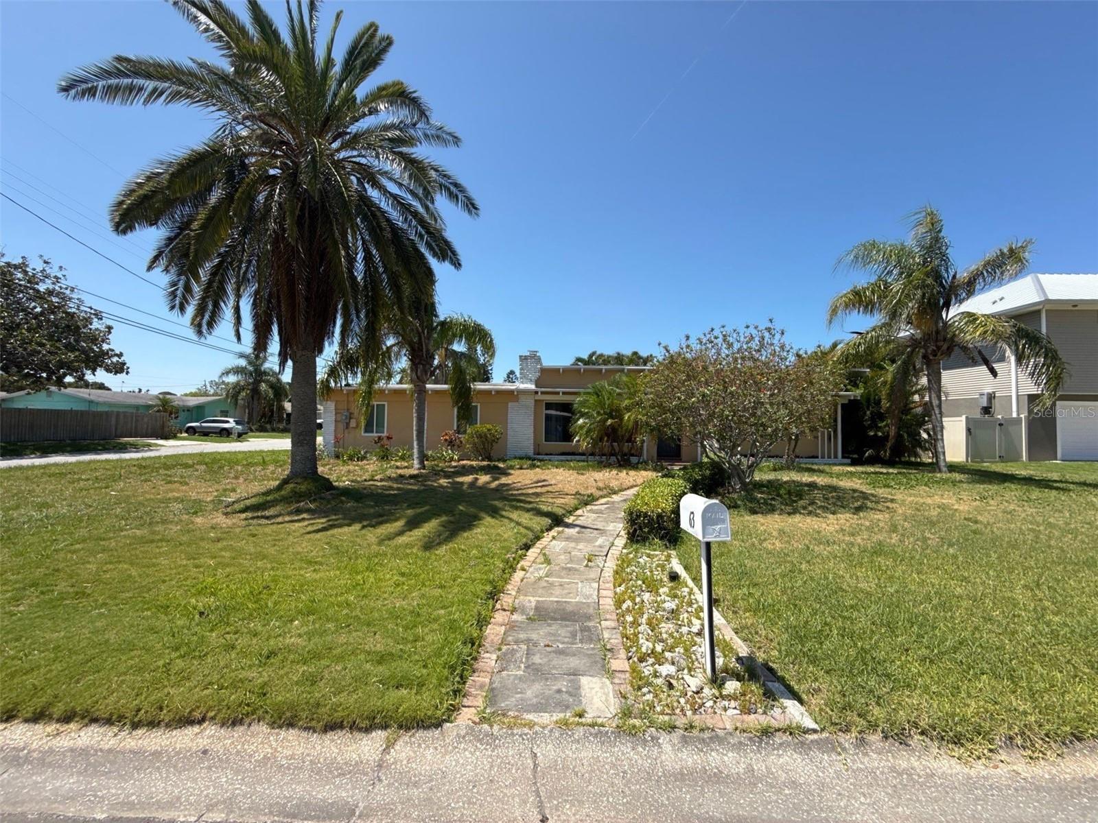 Prime investment opportunity in Dunedin, FL, this 2-bedroom, 2-bathroom home with a bonus room which can be converted into a 3rd bedroom offers 1,561 sq. ft. of living space and is ready for a remodel. The property has been professionally remediated following a prior flood, and the heavy lifting has already been completed with permits pulled, inspected, and closed for demo, HVAC and electrical. Updates include a brand-new HVAC system installed in 2025, an electrical service upgrade to 200 amps, and hurricane impact windows throughout. Flood cuts remain in place, leaving a clean slate for the next owner to design and rebuild to their own specifications. Whether you are an investor seeking a project in a prime location or a buyer looking to create your dream home, this Dunedin property presents an excellent opportunity in one of Tampa Bay’s most desirable coastal communities.