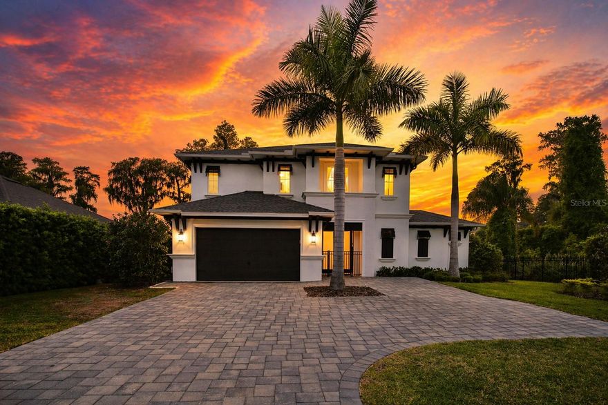 WEST-FACING LAKEFRONT POOL HOME ON SKI-SIZED RAINBOW LAKE
Located in Odessa, this custom-built ICI Homes Costa Mesa floor plan offers 4 bedrooms, 3.5 bathrooms, and approximately 2,930s quare feet of well-designed living space with water views from most rooms.

The first-floor owner’s suite features lake views, dual walk-in closets, dual vanities, and a walk-in shower with dual shower heads. The main living area includes soaring ceilings, an electric/propane fireplace, and pocket sliding glass doors that open to the covered lanai, creating seamless indoor/outdoor living.

The kitchen is equipped with quartz countertops, a large island, gas/propane cooktop, GE Profile stainless steel appliances, shaker-style cabinetry, and a temperature-controlled, large glass-enclosed climate-controlled wine room. A built-in SONOS sound system extends throughout the main living areas, owner’s suite, outdoor patio, and second-floor balcony.
Upstairs includes three additional bedrooms, a loft/game room, a private balcony with lake views, and a large climate-controlled storage room.
Outdoor features include a west-facing backyard with sunset views, a custom pool with water features (2024), expanded paver patio, summer kitchen, and a private dock (2021) with composite decking, water, electricity, and a 6,000 lb lift. Additional improvements include a paver driveway, parking pad, and walkway to the dock.
Situated on 48-acre Rainbow Lake within a gated setting surrounded by conservation areas, offering added privacy. Additional features include a security system with cameras and smart home elements.
Conveniently located near shopping, dining, and top-rated schools, including Steinbrenner High School.