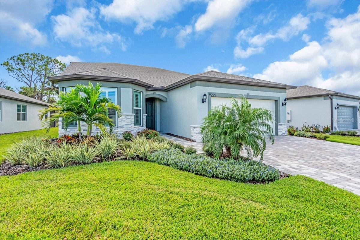Immaculate, Like-New Home in Premier 55+ Community
This stunning 1.5-story home with 3 car tandem garage is loaded with upgrades inside and out—designed for both comfort and style. The chef’s kitchen boasts upgraded appliances, designer sink and faucet, and beautiful tile extending to the ceiling in the bath/shower area. Enjoy timeless touches such as wood plantation shutters, custom paint throughout, stone-accented exterior, and recessed lighting in every room and hallway.
A top of line Bosch refrigerator, Samsung steam washer and steam dryer, every closet has been meticulously customized with built-ins and/or ELFA brand shelving and drawers for ultimate organization. Highlights include: Extended screened lanai for relaxing or entertaining Zero-entry shower for convenience and accessibility. Upgraded faucets, sinks, and finishes throughout. Spacious 3-car tandem garage with premium upgrades including custom tiled garage flooring, garage has climate control system by Mitsubishi, fully insulated and L.E.D. lighting package. All professionally designed and installed.
Private upstairs guest quarters with bedroom, full bath, living area, and flex space perfect for an office, craft room, or bunk beds. This home is truly above average in every way and must be seen in person to fully appreciate the quality, detail, and pride of ownership.