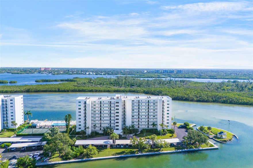 Also available as a seasonal rental! Welcome to 9397 Midnight Pass Rd #905 Sarasota, FL 34242 at The Pointe on Siesta Key, a fully renovated 1,348 SF, 2-bedroom, 2-bathroom luxury condo offering breathtaking Little Sarasota Bay and Intracoastal waterway views from the 9th floor. This stunning residence underwent a complete custom renovation in 2023, setting it apart from every other unit in the building. The open-concept kitchen features quartz countertops, vaulted ceilings with a bold rock-and-metal aesthetic, and a one-of-a-kind handcrafted glass-art backsplash, with bar seating connecting seamlessly to the dining and living areas, a custom layout rarely found at The Pointe. Luxury vinyl plank flooring flows throughout every room including the lanai, while wood acoustical paneling enriches both the living space and primary suite. Additional upgrades include HD-mounted televisions, a 2023 AC system, and a new LG washer and dryer, making this unit nearly turnkey and move-in ready. Step onto your private lanai, protected by hurricane-grade sliders, and take in tranquil water views of Little Sarasota Bay, where dolphins, manatees, and sailboats pass through calm Intracoastal waters daily. As a resident of The Pointe's gated five-acre community, enjoy resort-style amenities including boat docks, kayak and canoe access, a heated pool and spa, sauna, tennis and pickleball courts, BBQ gazebos, a clubhouse, and a fitness center with panoramic Intracoastal views. Located just minutes from Turtle Beach, Siesta Key Village, waterfront dining, local marinas, and coastal cafés, this property is ideal whether you're seeking a luxury Siesta Key waterfront residence, a vacation condo, or a Sarasota investment property. Negotiable furnishings available. Schedule your private showing today.
