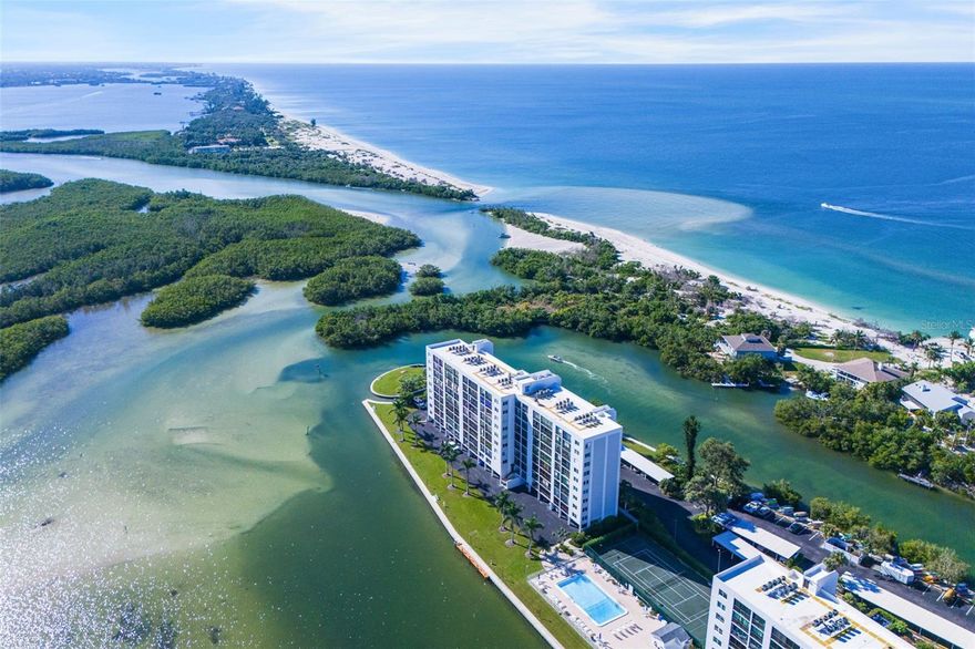 2023 Fully Renovated 9th-floor 2-Bed, 2-Bath Condominium Captures Sweeping Views Little Sarasota Bay and the Gulf of America.

Unit #905 at 'The Pointe' stands apart with a custom 2023 renovation that compliments its breathtaking surroundings; The kitchen showcases quartz countertops, vaulted ceilings with striking rock and metal aesthetic, and a handcrafted glass art backsplash that adds modern artistry. Bar seating flows naturally into the dining and living areas, showing off a custom open concept design rarely seen in this complex. Luxury vinyl plank flooring extends throughout every room, including the lanai, while wood acoustical paneling (sound cancelling) enriches the living space and primary suite. The home also includes HD mounted televisions, negotiable furnishings, a 2023 AC system, and new LG washer and dryer, blending luxury with turnkey convenience.

The lanai opens to tranquil bay views of 'Little Sarasota Bay' - protected by hurricane grade sliders. As an owner, enjoy the dolphins, manatees, and sailboats routinely passing through calm waters. The Pointe’s gated five-acre community offers resort-style amenities including boat docks, kayak and canoe access, a heated pool and spa, sauna, tennis and pickleball courts, BBQ gazebos, a clubhouse, and a fitness center with panoramic views of the Intracoastal. Just minutes from Turtle Beach, local dining, marinas, and coastal cafés, this residence combines privacy with proximity to island life.

From its elevated perspective to its exquisite finishes, this Siesta Key home delivers a lifestyle of distinction. Schedule your private showing today.