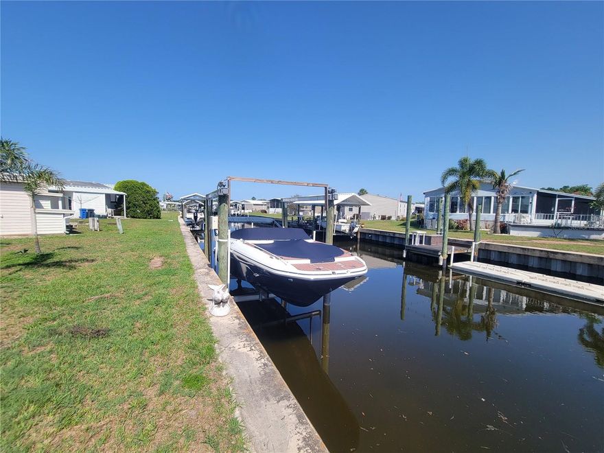 Experience the Best of Waterfront Living in Caribbean Isles
Welcome to your own slice of paradise in the heart of Caribbean Isles, a vibrant 55+ gated waterfront community in beautiful Apollo Beach, Florida.

This WELL FURNISHED 2-bedroom, 2-bath home offers a blend of comfort, style, and direct canal access to Tampa Bay right from your backyard. Imagine relaxing in your backyard as manatees and dolphins glide by, or heading out on your boat from your private 7,000 lb. boat lift for a sunset cruise. Be sure to click on the Virtual Tour to fully appreciate the incredible water access this home offers!
Step inside to discover a beautifully updated interior featuring: A modern kitchen with new cabinetry, Laminate flooring throughout, remodeled bath, upgraded HVAC supply/return lines, Foam floor insulation for energy efficiency.

But the lifestyle here is just as impressive as the home itself. Caribbean Isles offers everything an active adult could want: Direct water access for kayaking and boating, heated pool open year-round (80+ degrees), friendly games of bocce ball, shuffleboard, and horseshoes. Enjoy a lively clubhouse with a craft room, game room, billiards, darts, and bar shuffleboard and a calendar full of events, themed dinners, and dances to keep you entertained and connected.

Located conveniently between Tampa and Sarasota/Bradenton, you're just a day trip away from world-class beaches, shopping, dining, and amusement parks, making every day feel like a vacation. Don’t miss your opportunity to enjoy the Florida lifestyle you’ve always dreamed of. Come see why so many love to call Caribbean Isles home.