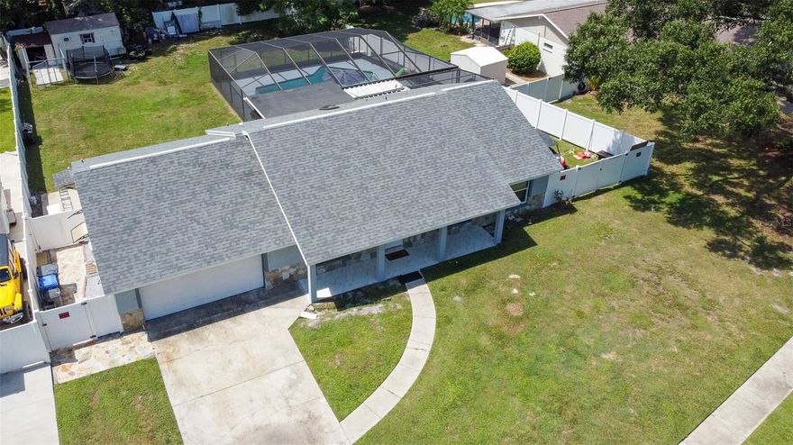 Welcome to your dream home in the highly sought-after North Dale neighborhood of Tampa! This spacious 4-bedroom, 3-bathroom haven offers an exceptional blend of comfort and convenience for your family. Nestled in a desirable community with top-notch schools, this residence is the epitome of family-friendly living. You will love the safety of sidewalks for playtime, and the warm camaraderie of this quiet, friendly neighborhood. As you step inside, you'll be greeted by an inviting open-concept layout. The living room boasts an electric fireplace, perfect for cozy evenings, while the dining room benefits from a newly installed skylight that floods the space with natural light. This homeowner has spared no expense in upgrades, making this home truly turnkey. Enjoy the beauty and durability of ceramic tile throughout the entire house. A new roof installed in 2019 and impact double-pane windows ensure peace of mind. The heart of this home, the kitchen, has been thoughtfully updated with quartz countertops and modern cabinets, offering both style and functionality with updated European style wall microwave and oven, a wine fridge and area, deep dish dual sink with a glass cooktop and hood as the center piece of the kitchen as well as a newly installed French door fridge and even storage under the sitting bar along the island. Venture outdoors to discover a spacious backyard complete with a shed for storage, a perfect spot for your BBQ gatherings. The highlight is a massive pool, ideal for those sunny Florida days, surrounded by an outdoor screened-in kitchen and pool area that's sure to be the hub of family entertainment. But that's not all – the garage has been transformed into a versatile living space with its own entrance, featuring a small kitchen, living room, an additional room, and a bathroom. This flexible space could serve as a guest suite, an office, or anything you desire. The motivated sellers are ready to make your homeownership dreams come true. Don't miss out on this North Dale gem – it's an opportunity that won't last long!