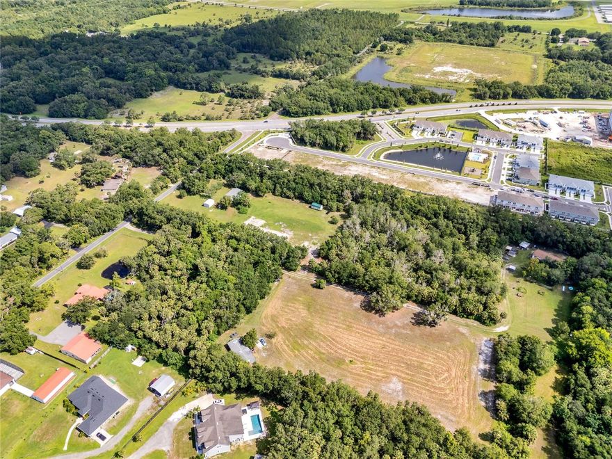 Prime location for new construction! Just south of Lake Mary Boulevard and Orlando Sanford International Airport lies the ideal potential to build a small development of single-family homes or your dream home on more than four acres. A tranquil retreat but convenient to SR 417, SR-46 and Interstate 4 in Sanford, this cleared lot exudes natural beauty with possibilities. With national builders constructing homes nearby and new commercial and retail complexes, such as Publix at King’s Crossing and Boombah Sports Complex, this location offers the best of action and relaxation. There is a manufactured home on the property with electricity, well and septic services. Recent reports available. Buyer to verify all information.