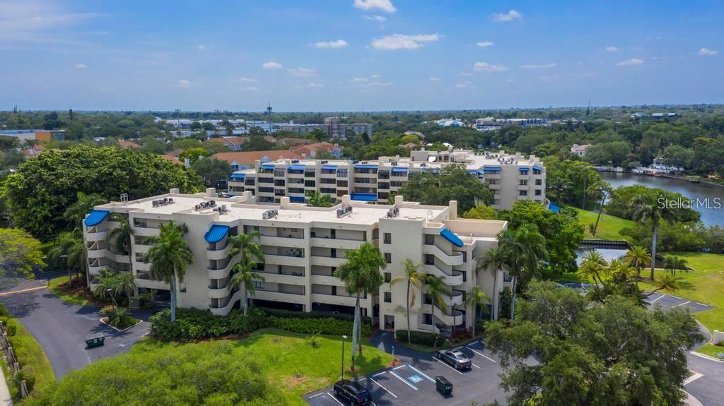 One or more photo(s) has been virtually staged. Welcome to Central Park! This pet-friendly community is located on a 6 acre park-like setting along the Hudson Bayou, where natural beauty meets urban convenience! This rarely available, 2 bedroom, 2 bath, South-facing condo boasts a bright, airy, and inviting open floor plan, perfect for modern living and entertaining. Enjoy a serene and private outdoor space on your covered terrace, accessible by both the primary bedroom and open living space. Engineered bamboo and ceramic tiling throughout provide a neutral and vibrant space that awaits your personal touch. This move-in ready space also offers the convenience of in-unit washer and dryer and under-building parking. You’ll enjoy a year-round heated pool, community grills, kayak launch and storage. A recently upgraded premium Xfinity wi-fi and cable package is included with your association dues. Seller is offering a one-year home warranty, covering plumbing, A/C and hot water heater. One parking space included, but additional under-building spot available for nominal fee. Central Park is walking distance to Shelby Gardens, and the vibrant shops and restaurants of Southside Village and downtown Sarasota. It’s central location offers quick and easy access to Sarasota’s barrier islands. Siesta Key Beach (recently voted #1 beach in America) is literally around the corner. Schedule your private showing today! Possible seller financing available!