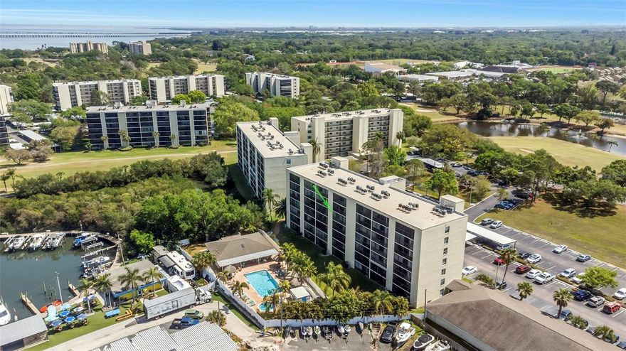 Welcome to a truly move-in-ready retreat on the shores of Tampa Bay. This updated two-bedroom, two-bathroom condo offers the kind of "lock-and-leave" lifestyle that is hard to find, starting with the peace of mind of a 24/7 security guard at the entrance. From the moment you step inside, the space feels bright and inviting, with natural light pulling you toward the sliding doors. The kitchen has been fully modernized with sleek granite countertops and stainless steel appliances, and both bathrooms have been tastefully upgraded to match. It is a clean, contemporary home where all the hard work has already been done for you—including a newer roof for the building. What really makes living here special are the incredible views from the porch. Whether you are starting your morning with a coffee or winding down at sunset, the balcony offers a front-row seat to the beauty of the bay. This effortless living is backed by an all-inclusive HOA that takes the guesswork out of your month. Instead of juggling multiple bills, your fee covers nearly everything: internet, cable, water, sewer, and trash, along with exterior maintenance and building insurance. It is designed for someone who wants to spend their time enjoying the water rather than worrying about utility deadlines. The community amenities feel more like a resort than a standard neighborhood. You are just steps away from a recently renovated pool and spa, a clubhouse for gatherings, and a private marina where you can rent boats or kayaks. If you are a golfer, the Cove Cay Golf Club is right on-site, offering championship play with some of the best views in Clearwater. You do not even have to leave the gates for a great meal, as the Bayview Grill is open seven days a week. Perfectly positioned in the heart of Tampa Bay, you are minutes from the airport, 20 minutes from the sand at Clearwater Beach, and a short drive to the vibrant dining scene in Downtown St. Pete.