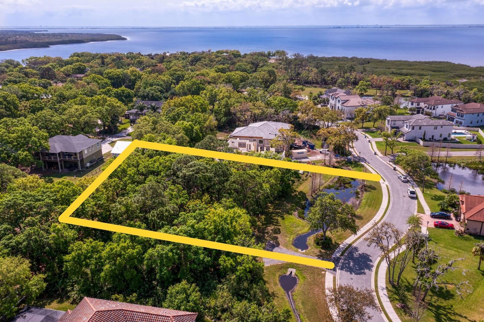 Build your dream home... wide and deep lot nestled in between Million $ plus homes in gated Marsh Pointe. On the northern shores of Old Tampa Bay, Marsh Pointe, a coastal community is almost completely built out. This gated, enclosed "by the bay" residential subdivision contains just 26 home sites and you can pick your own builder. The location is quiet and peaceful, surrounded by wildlife and the smell of the bay, yet, you are ideally situated right on the border of Hillsborough and Pinellas County. Nearby Hillsborough / Tampa Rd leads you to everything you need; restaurants, shopping, the airport, beaches, downtown Tampa, St. Pete. and Clearwater. This is one of the last opportunities to buy and build in this beautiful community!! The property has already been surveyed and soil reports complete and available. The property is also for sale with a to be built dream home. See MLS #TB8398972 for more details.