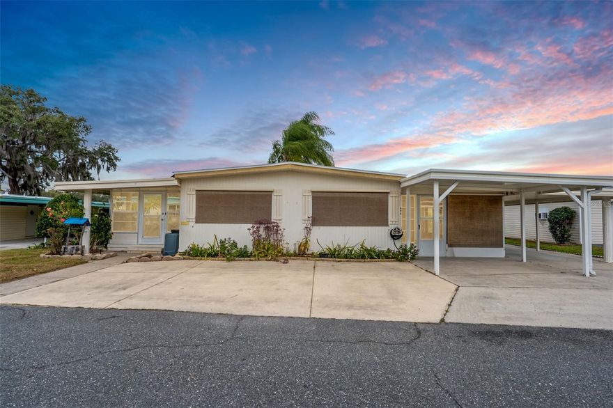 Discover easy Florida living in this thoughtfully designed home located in Bonfire Mobile Home Village, a friendly 55+ community just minutes from historic Leesburg. Inside, you’ll find two generously sized bedrooms and two full bathrooms. The guest bathroom includes a walk-in shower, while the primary suite features a private bath with a convenient walk-in tub. Just off the primary bedroom is a flexible bonus space, ideal for a home office, den, or optional third sleeping area. Comfort and versatility define this home, highlighted by a bright Florida room that provides additional year-round living space, along with a welcoming lanai perfect for enjoying the outdoors. Practical features include an extended driveway, covered carport, and a sizable storage shed with double-door access, ideal for storing a golf cart, tools, or recreational gear. The home is also prewired for a gas-powered whole-house generator, offering added peace of mind. Set within a beautifully maintained, tree-lined community along Haynes Creek, Bonfire Mobile Home Village offers access to the Chain of Lakes and the St. Johns River. Residents enjoy a variety of amenities, including a swimming pool, spacious clubhouse, billiards area, shuffleboard
courts, and a community library, all in a serene Central Florida setting.