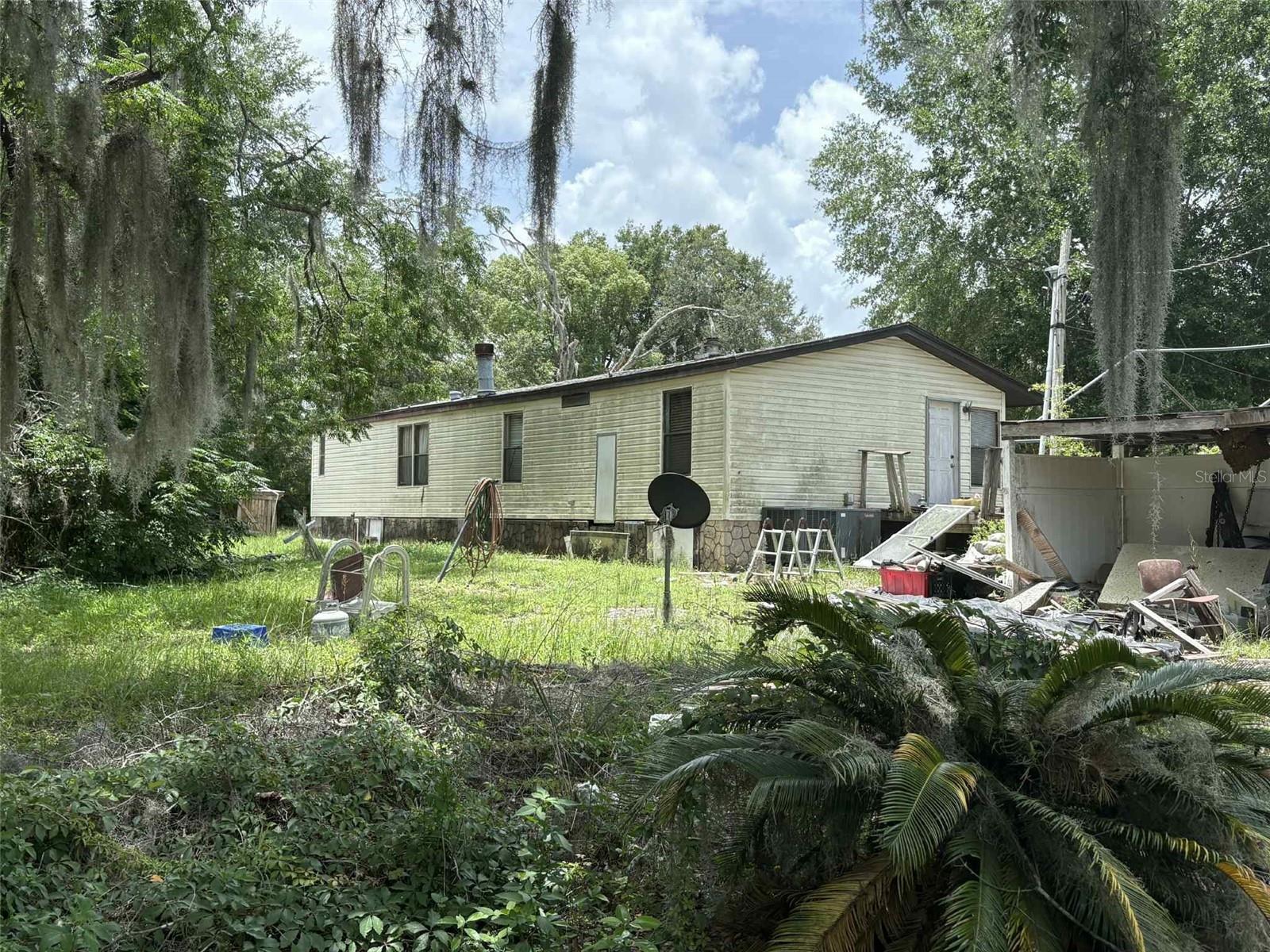 Diamond in the Rough – 2 mobile homes on 5 acres! This unique property offers tremendous potential and is ideal for investors or flippers. The estate has already been through probate and is being sold AS IS, with no repairs to be made by the seller. The first mobile home features 3-bedrooms and 2-bathrooms, while the second mobile offers 2-bedrooms and 2-bathrooms—making this a versatile opportunity for renovation, rental income, or redevelopment. Cash only and open to all offers. Don't miss your chance to bring this property back to life!