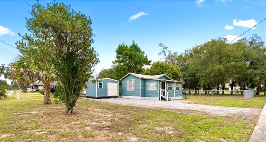 Start living your best Florida life in this adorable little house located just a quick walk from downtown Tavares, the hub of Lake County, otherwise known as America's Seaplane City!! Only a .5-mile walk leads you down a meandering boardwalk overlooking the lake to the waterfront district with restaurants, shops, Wooten Park, the Marina, City Hall, and the infamous Sea Planes!!  Recent updates have been made to turn this 2-bedroom and 2-bathroom home into a perfect starter home, short term or long-term rental, or winter retreat!  As you enter the front door there is an open concept kitchen overlooking a living area, and a small dining space, a bar top also allows for island seating looking into the kitchen. An inside laundry area sits to the side of the dining space separated from the main room by a door. The full kitchen has dark modern cabinets and solid surface countertops, a pantry, and it leads back to two separate bedrooms each with their own en suite bathrooms. Bedroom one sits to the back of the home and has a tub/shower combo. Bedroom 2 has a standup shower, new vanity, and an additional space in the room for a dresser or desk area. New vinyl flooring is throughout the home, with neutral colors, and stylish bathrooms. This home is ready to go and sure to please!! Sitting on a large corner lot there is plenty of room for additional vehicles or to add a garage. A shed with power hooked up sits to the side of the home and a large, fenced yard sits to the other side. With NO HOA, and the home's convenient location this home is sure to go fast. Love Bass fishing? Sitting just a few steps from the Harris Chain, this home can be a perfect Fishermans paradise, Boaters dream, or Sea Plane enthusiast's retreat. A few of the photos have been virtually staged. Agent/Owner.