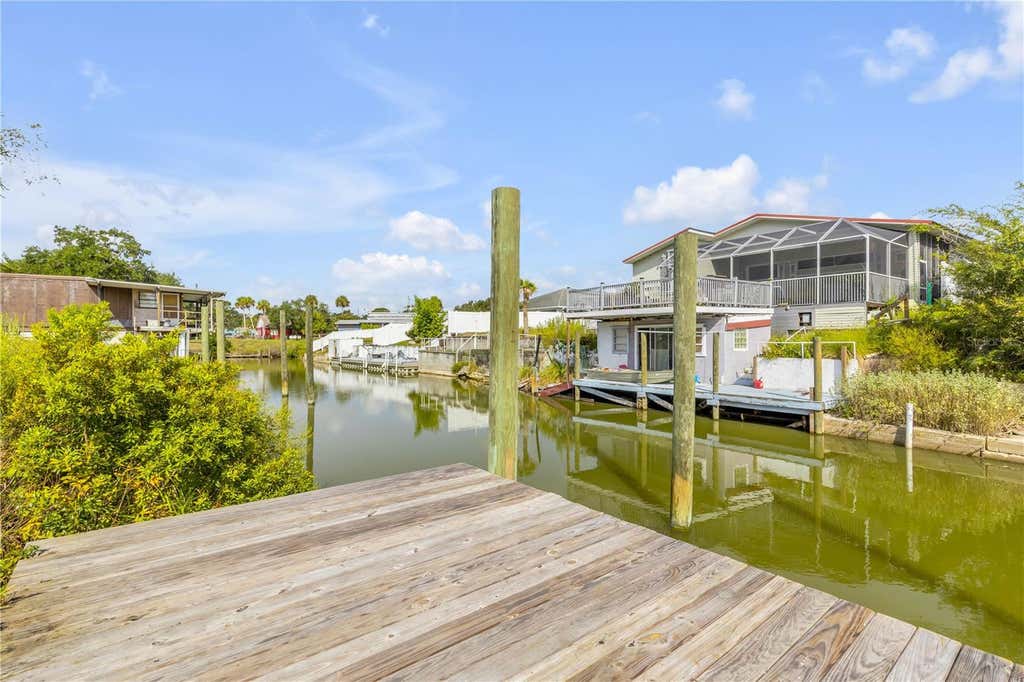 Photo of 128 Indian Creek Road, Oak Hill, FL 32759 (MLS # NS1089103)