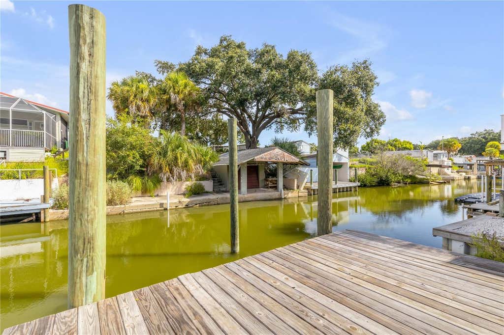 Photo of 128 Indian Creek Road, Oak Hill, FL 32759 (MLS # NS1089103)
