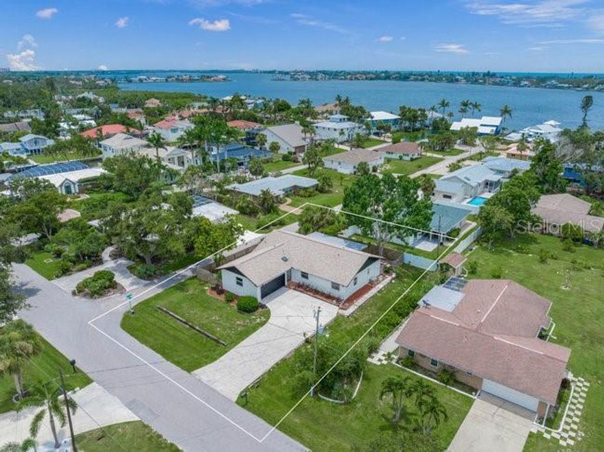 Walk to Siesta Key! | West of the Trail | No HOA

Updated one-story coastal home less than 2 miles to Siesta Key Beach and Little Sarasota Bay, located west of the Trail off Stickney Point Rd. Set on a large, elevated corner lot in a quiet neighborhood with wide streets and minimal traffic.

Block construction with open floor plan and abundant natural light. Recent upgrades include impact windows (2025), new roof (2024), new sliders, luxury Mannington laminate floors, solid wood interior doors, fresh paint, and updated lighting. Oversized 2-car swing garage.

Redesigned kitchen features all new custom soft-close cabinetry, pantry, quartz countertops, stainless appliances, vaulted ceilings, and tiled backsplash—open to living and dining areas. Both bathrooms fully renovated with tiled showers, glass enclosures, and modern finishes.

Enjoy a screened lanai, wood deck, and patio. Water softener, . Close to downtown Sarasota, Southside Village, St. Armands, Lido & Longboat Key. Zoned for Gulf Side Elementary.