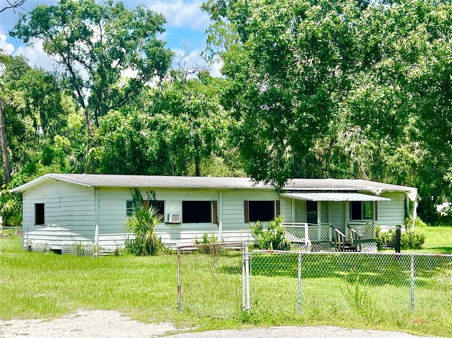 This is an ideal property AND LOCATION to BUILD YOUR OWN DREAM HOME!  There's NO HOA or CDD and it's .86 of an acre!  The community is comprised of large properties, assuring plenty of space between homes in a serene and quiet neighborhood.  There are single family homes, as well as modular homes and manufactured homes.  The manufactured home on this property was damaged during Hurricane Milton, and the occupant had to move out.  The home has been cleared out, and could possibly be repaired if the buyer has resources.  The electricity has been turned off by the seller for safety reasons.  The septic is near the SW corner of the home, and the white well house is located on the backside of the property.  There is a pond on the East side of the property which could accommodate a relaxing water feature with some creativity....OR the pond could be filled in, giving more yard space.  There are four 60-foot steel beams currently under the base of the home which can be utilized for a new home.  The property is zoned RSC-2 which means only 2 homes per acre, and since there's not quite an acre, it can only allow one home.  The dimensions of the property are 246' x 162'.  See photo captions for more details about the property.  AND WHAT A GREAT LOCATION TOO!  This community is zoned for TOP-RATED SCHOOLS, and is close to The Brunchery, The Landing Bar & Grill, and several other retail/professional businesses. A mile north on the corner of Lithia Pinecrest & Bloomingdale Ave, there is a plethora of shopping, Publix, Sprouts, JF Kicks Bar & Grill, Bullfrog Brewery, Chili's, Panera, Crunch Fitness, and so many other great establishments....AND a Whole Foods is currently being built at that corner too.  Within 30-45 minutes of many state parks, MacDill Air Force Base, Downtown Tampa, Tampa Int'l Airport, Busch Gardens, and only an hour from TOP-RATED BEACHES and the DISNEY/Orlando area!