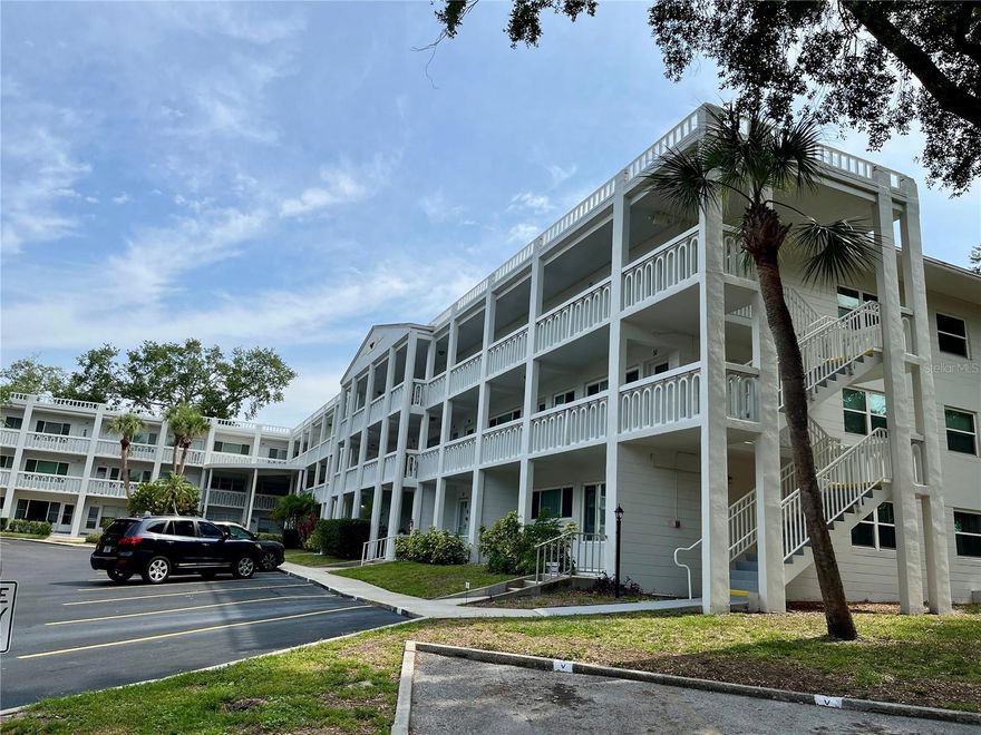 Modern updates and fully furnished. Rare condo with current updates. Vinyl floors and hurricane impact windows throughout. Kitchen features stainless steel appliances, butcher block countertops, glass backsplash, 2 tone cabinets and under cabinet lighting with island. Both bathrooms fully updated. Florida room has a picturesque view over courtyard. This condo has it all.  Assigned parking. The 55+ community has two activity centers, and two private golf courses with 9 and 18 holes, free exclusively for resident owners. There are two heated swimming pools. The remodeled Cardio Gym has the latest exercise equipment. A very pet-friendly community, there is a fenced dog park with covered seating. There are hobby studios, and a wood shop for the exclusive use of the residents. Activities include fitness classes, dancing, clubs, cards, billiards, entertainment, classes, and much more. The on-site Good Karma Café has take & bake meals and snacks. Close to beaches, transportation, shopping, entertainment, and fine dining. All room sizes, floor plans and square footage are approximate. This property is being transferred by a leasehold estate deed. Association approval is required. If financing, a 35% down payment is required.