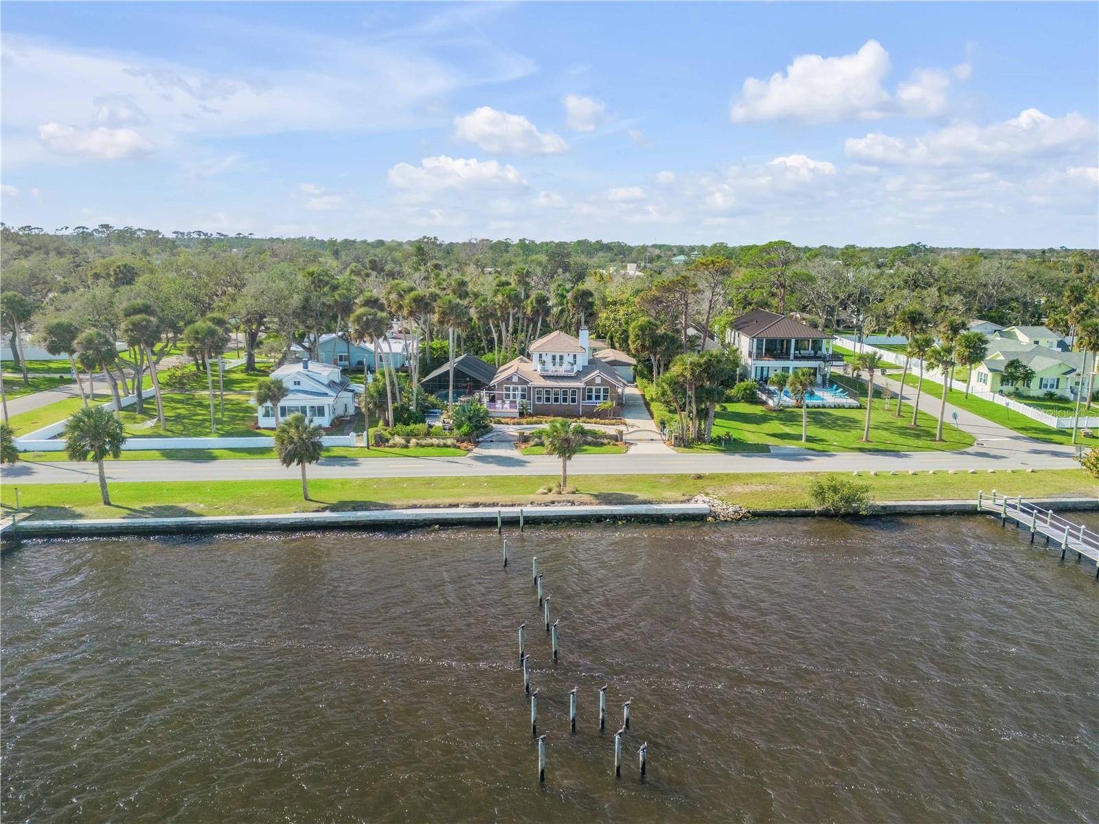 Direct Intracoastal waterfront beautifully remodeled 4-bedroom, 3-bathroom, 2-car garage home in the heart of Port Orange. Timeless charm with modern upgrades, this home offers a warm and inviting atmosphere. The spacious living room features a stunning historic coquina fireplace, creating the perfect backdrop for cooler evenings. With two expansive master suites, one upstairs and one downstairs, each with a luxurious en-suite bathroom, you’ll have the ultimate retreat to unwind and relax. The chef-inspired kitchen boasts high-end KitchenAid appliances, making it a delight for cooking enthusiasts. Step outside to a tropical backyard paradise, where an oversized pool and spa, designed to be heated or cooled, promise year-round enjoyment. The property is equipped with thoughtful updates, including a newer AC, dehumidifier, generator, updated electrical systems, hurricane windows, and a recently poured seawall. The roof was replaced in 2016, and the home’s elegant details, like crown molding and a circular driveway, add an extra touch of sophistication. Located in a historic neighborhood, this home is moments to the beach, top-rated schools, parks, and shopping. With the option to add a dock and stunning views of the Intracoastal waterway from both the master suite and front yard, this home is a rare find for those seeking both luxury and convenience. The Intracoastal waterway gives ocean access for a mariner to travel the world! Schedule your showing today and start making travel plans tomorrow!