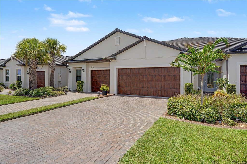 Photo of 10228 Echo Dock Loop, San Antonio, FL 33576 (MLS # TB8539216)