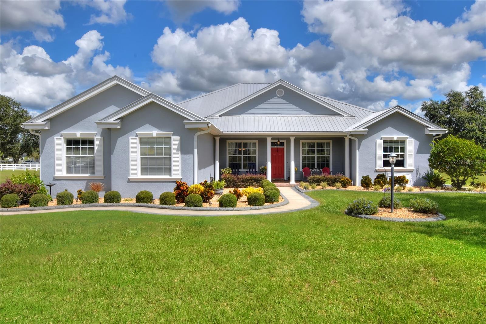 Gorgeous Custom Home in Historic Socrum!
Stunning and timeless, this custom-built home sits proudly on 1.42 acres in the sought-after historic Socrum area. Built in 2004, it welcomes you with a charming front porch and an inviting foyer that sets the tone for the elegance inside. This home is perfect for entertaining!
Enjoy the flexibility of formal living and dining spaces—the living room currently serves as a home office but could easily become a 4th bedroom if desired. The heart of the home is the open kitchen featuring gleaming stainless steel appliances, granite counters, a closet pantry, and a breakfast bar overlooking both the sunny breakfast nook and the expansive Great Room.
Step outside through sliding glass doors to a sweeping 45-foot-long covered patio, perfect for breezy Florida evenings. From here, take in views of the sparkling pool, wide-open yard, and the surrounding custom homes.
The split-bedroom design ensures privacy, with the primary suite offering a true retreat. Indulge in the dream bath with a jetted tub framed by elegant columns, a spacious walk-in shower, dual vanities, and dual closets. Additional highlights include crown moulding, a generously sized second bedroom with a large walk-in closet, a side-entry 3-car garage, plus a separate workshop.
All of this, in a peaceful setting that feels like you’re away from it all—yet just minutes from the best of Lakeland.
Welcome Home to fantastic Florida living!