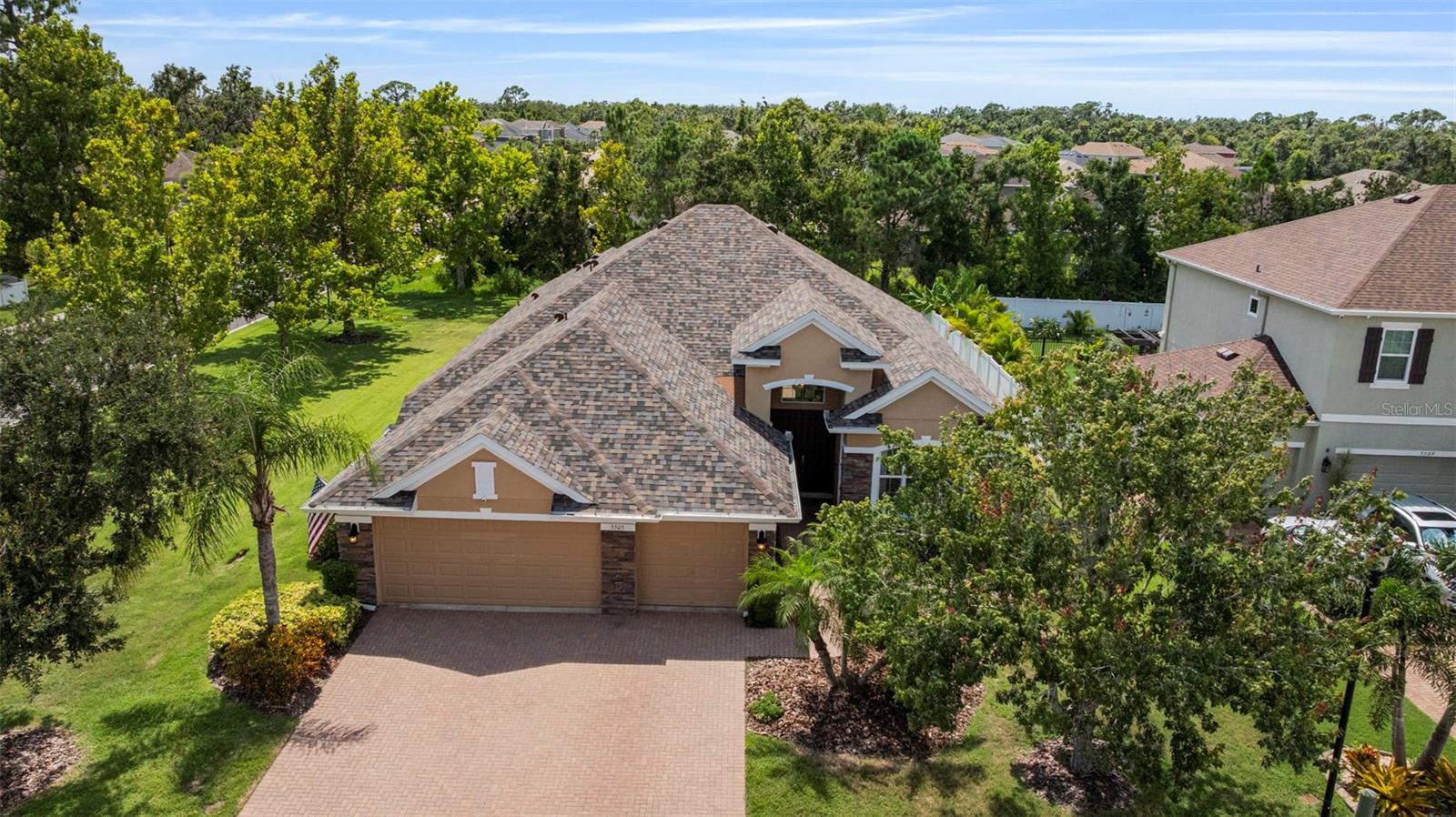 One or more photo(s) has been virtually staged. Storm-Ready Luxury on Over 1/3 Acre | Custom Kitchen, New Roof, Whole-House Generator & Prime Location
Tucked away on a spacious corner lot in a quiet cul-de-sac, this beautifully upgraded 4-bedroom, 2-bathroom home offers the perfect blend of safety, style, and everyday comfort. Located in the desirable gated community of Oakleaf Hammock—with no CDD fees—this home is surrounded by tree-lined streets and well-spaced homes that give the neighborhood its charming, tranquil character.
Built for Florida living, the home comes storm-ready with a brand-new roof (2025) and a whole-house Generac generator (2024) for uninterrupted peace of mind. The Progressive MagnaTrack Motorized Hurricane Screen System, installed in 2024, offers Category 5 wind protection and features high-performance mesh that blocks up to 97 percent of UV rays, repels rain, and keeps even the tiniest pests—like No-See-Ums—out. With smart home integration, you can raise and lower the screens by remote, app, or voice command. They cool the lanai, keep furniture clean and dry, and enhance energy efficiency indoors. A 15-year warranty on the screens and a 5-year motor warranty offer long-term confidence.
Inside, you'll find soaring ceilings and a bright, open layout that invites natural light and effortless flow. The chef’s kitchen is a true showstopper, boasting custom maple cabinets with pull-out shelves and built-in organizers, granite countertops, a wall oven, stone backsplash, stainless steel appliances, and plenty of space for gatherings. A whole-house water purification system and reverse osmosis at the kitchen sink ensure fresh, high-quality water throughout.
Retreat to the primary suite, where a tray ceiling adds architectural charm and sliding doors open to the lanai—your own private escape. The ensuite bath features dual vanities, a soaking tub, and a walk-in shower.
Even the laundry room delivers, with built-in cabinetry, a utility sink, front-load washer and dryer, and a walk-in storage closet that keeps everything neat and accessible.
The oversized 3-car garage includes a built-in workshop space—perfect for hobbies, projects, or extra storage.
Conveniently located near I-75, this home gives you easy access to Sarasota, Tampa, St. Pete, and world-class beaches and shopping.
This is more than just a home—it’s storm-secure, custom-crafted living in one of the area’s most peaceful and well-located communities. Come see what makes this home truly exceptional!