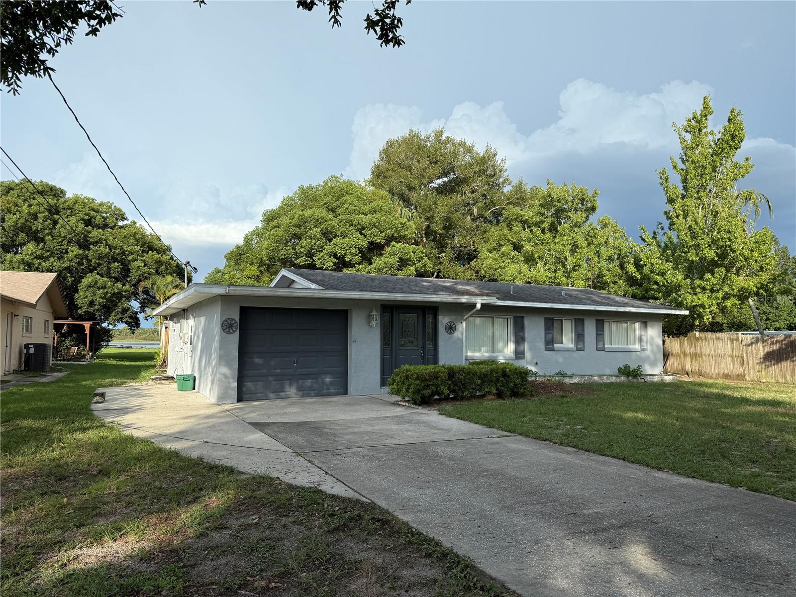Lakefront living at a great price! This property located at 151 S Triplet Lake Dr features 3 bedrooms and 2 bathrooms. The living room offers ample space for relaxation and entertainment, while the bedrooms provide comfortable accommodations. The bathrooms are equipped with a tub/shower combination in one and a shower on the other for convenience. The property includes amenities such as air conditioning, heating, and ceiling fans to ensure year-round comfort. Additionally, it is smoke-free and offers washer/dryer hookups for laundry needs. There’s a washer in place already. The exterior features waterfront access, providing a scenic view and outdoor recreational opportunities. This home is ideal for those seeking a spacious and well-equipped living environment and an expansive outdoor area with lake access.
