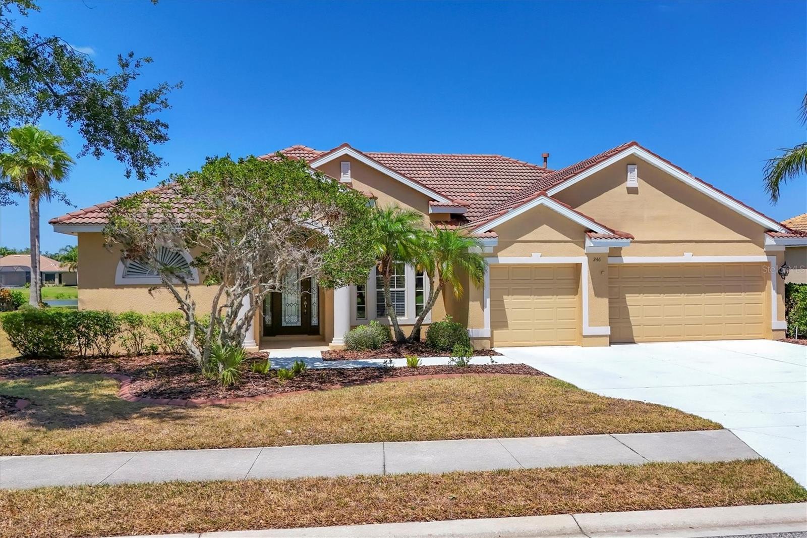 PRICE IMPROVEMENT!! Experience elegant Florida living in this executive-style two-story home offering 3,095 sq. ft. of thoughtfully designed space and breathtaking lake views. The open floorplan features soaring ceilings and includes a formal living room and dining room, along with a spacious kitchen and breakfast nook framed by striking aquarium glass. The first floor hosts three generously sized bedrooms, including a luxurious primary suite, three full baths, a versatile den with built-in desk, and multiple sliding glass doors in the living and family rooms that lead to a screened lanai overlooking tranquil lake and preserve views. Upstairs, a large bonus room awaits, complete with a wet bar and half bath—ideal for entertaining or relaxation. A small fenced area provides a safe space for pets, and there is ample room to add a custom pool. Nestled within the highly desirable gated community of Greyhawk Landing, residents enjoy premier amenities including two resort-style pools, a lagoon-style pool with waterslide and spa, fitness center, tennis and basketball courts, playgrounds, sports fields, and miles of scenic trails for walking and biking.