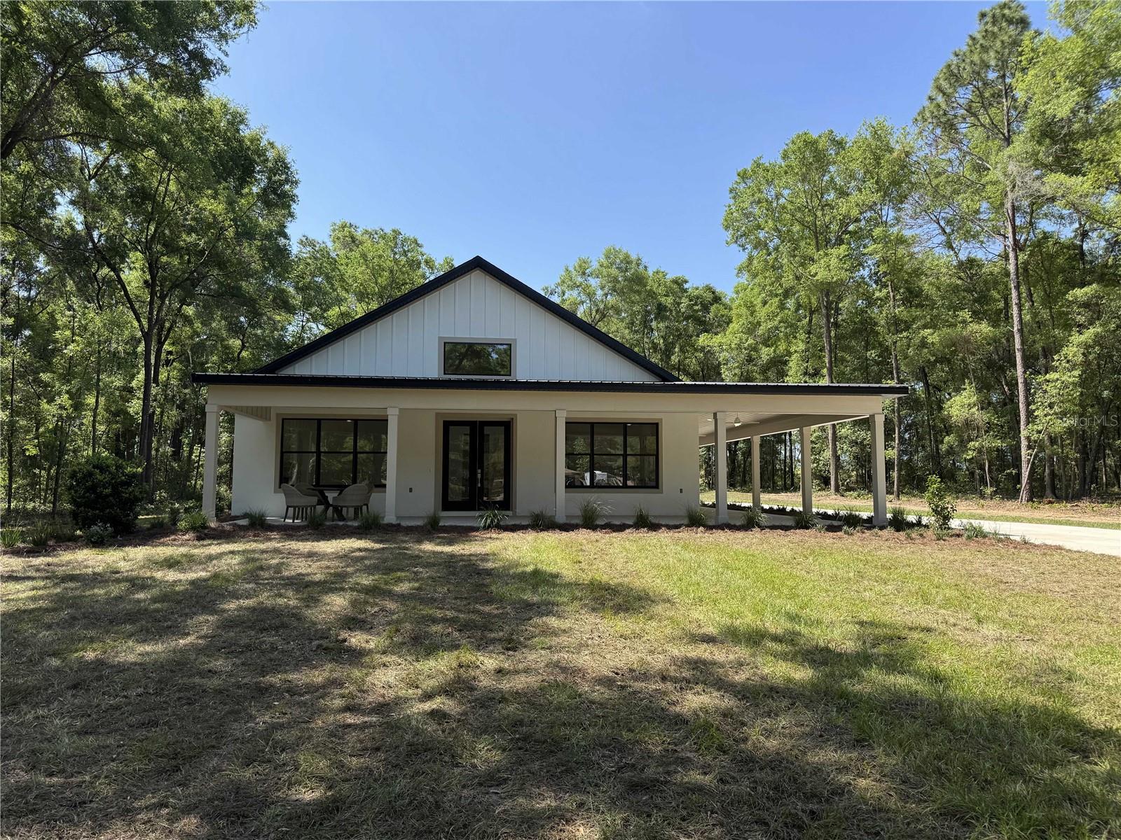We are excited to share details about our new custom home, set to be featured in this year's "Parade of Homes." This stunning model includes 4 bedrooms and 3 full baths, designed with an open-concept living area that truly impresses.
The home is further enhanced by:
* An electric fireplace
* Shiplap accents
* Wood beam
* White slim-line shaker cabinets with quartz tops
* Café appliances
Enjoy the outdoors on the large wrap-around porch, perfect for multiple furniture arrangements. The entire home features 10' ceilings, 8' doors, and ceramic tile throughout. The master bath is designed as a spa-like retreat, complete with a large cast iron tub and multi-head walk-in shower. The oversized 2-car garage includes full attic storage above.
The property is situated on over 2.25 acres, offering ample space for additional clearing and the option to add a barn. Located on a paved road, the land backs onto a large farm, ensuring privacy. Plus, the home comes with a full builder’s warranty for your peace of mind.