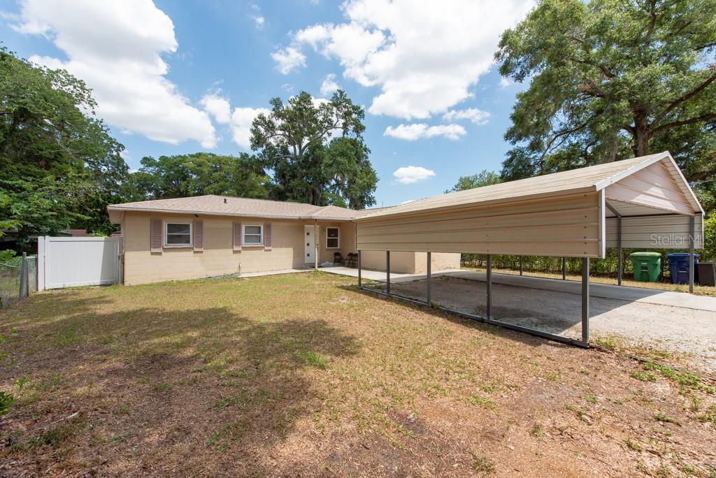 Uncover your perfect home in Tampa, Florida! This delightful 4-bedroom, 1-bathroom home offers 1,272 sq ft of comfortable living space. Located on a very quiet road, this property boasts a double carport, ensuring ample parking space. The vinyl-fenced yard provides privacy and features a spacious backyard, perfect for outdoor activities, along with a shed for extra storage, while a screened-in porch allows for enjoyable outdoor relaxation. The interior of the home showcases ceramic tile flooring throughout, offering a clean and cohesive look. The updated kitchen is a highlight, featuring new granite countertops, new cabinets, and a stylish backsplash, making it a delightful space for cooking and entertaining. Situated in a no flood zone and with no HOA fees, this home is both secure and economical. Conveniently close to I-4 and other major highways, it provides easy access to shopping, dining, and entertainment options such as Busch Gardens, Hard Rock Casino, Downtown and Port of Tampa, Amalie Arena, Raymond James Stadium, and USF. This property offers a perfect blend of comfort, convenience, and location.