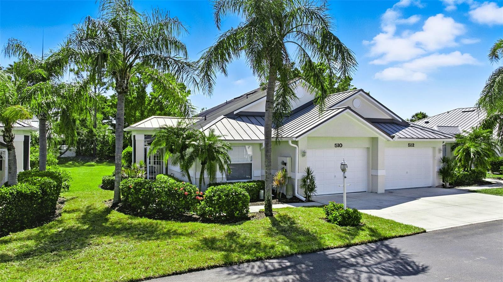 Looking for the perfect Florida get away? This maintenance-free two bedroom villa is located in the gated resort community of Burnt Store Marina and offers a fabulous option. Move right in without lifting a finger as it comes with a tasteful turnkey furniture package so you can settle in and start enjoying paradise right away. This desirable end unit boasts a pleasing open floorplan filled with an abundance of natural light and soaring ceilings. The expansive kitchen features abundant cabinetry finished with top molding, tile backsplash and granite countertops. A handy built in dining table and breakfast bar provide casual dining options. A new Frigidaire refrigerator was added in 2025, and dishwasher and disposal a few years ago. Additional storage is available in the convenient pantry closet. The inviting living and dining area boasts neutral laminate flooring and sliding glass doors that open to a charming tiled, screened lanai. From here, you’ll enjoy a serene, park-like backyard view, along with a bonus paver patio—perfect for morning coffee or evening relaxation. Delight in the tropical breezes when you open the door to the front and back lanais and feel like you have found heaven. The generously sized primary suite enjoys a dramatic vaulted ceiling and large window overlooking the yard, walk-in closet and ensuite bathroom with a tiled walk-in shower and stone-topped vanity. The guest bedroom is located on the opposite side of the residence and features a bump out large window to welcome in the Florida sunshine with an adjacent upgraded guest bath creating a comfortable and private space for visitors. The laundry room leads you to the attached oversized one car garage to store all of your recreational gear. The complex boasts a handsome metal roof and takes care of all exterior maintenance. The monthly fee also includes internet and cable. Best of all is the incredible lifestyle that is offered at Burnt Store Marina which offers an impressive array of amenities, including a 27-hole golf course, waterfront dining, fitness and racquet club, and the largest deepwater marina on Florida’s west coast. Whether you’re boating, golfing, playing pickleball, or simply lounging by the pool, every day feels like vacation.