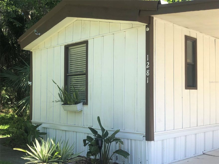 CLOSE TO EVERYTHING BUT I HEARD BIRDS SINGING AND EVEN A ROOSTER CROW IN THE BACKGROUND SO I THOUGHT I WAS IN THE COUNTRY. YES COUNTRY LIVING CLOSE TO EVERYTHING. THIS PROPERTY HAS MORE THAN MEETS THE EYE. THE MANUFACTURED HOME IS CUTE AS A BUTTON AND HAS  THREE BEDROOMS AND TWO FULL BATHS. THEN THERE IS THE GARAGE/WORKSHOP MAYBE AN APARTMENT! THIS GARAGE WAS STARTED AS A HOUSE AND NEVER FINISHED. IT IS 1500 SQ FT. IT IS WIRED FOR 220 + HVAC, WELDER OR AIR COMPRESSOR, AND IT HAS WATER AND A WORKING SINK.  YOU COULD HAVE THE BEST WORKSHOP EVER OR MAKE AN ADDITIONAL LIVING SPACE. THIS HOME IS ON NEW SMYRNA UTILITIES AND HAS CITY WATER. IT IS ALSO ON SEPTIC TANK THAT HAS RECENTLY BEEN CLEANED OUT AND INSPECTED, WHICH MAKES FOR LOWER UTILITIES. THE PROPERTY IS HIGH, SO NO WET PROPERTY WHEN IT RAINS. THE YARD HAS A FENCED PORTION FOR CHILDREN OR PETS OR FOR JUST ENJOYING OUTDOOR COOKOUTS. THERE IS A LARGE SCREENED IN PORCH WITH TWO EXIT DOORS AS WELL AS A CARPORT. NICE LANDSCAPING AND A LARGE VACANT LOT NEXT DOOR WHICH GIVES YOU LOTS OF PRIVACY. CLOSE TO THE BEACH, AIRPORTS AND SHOPPING. THE LOWEST PRICED LIVING IN NEW SMYRNA BEACH. ;Water: City