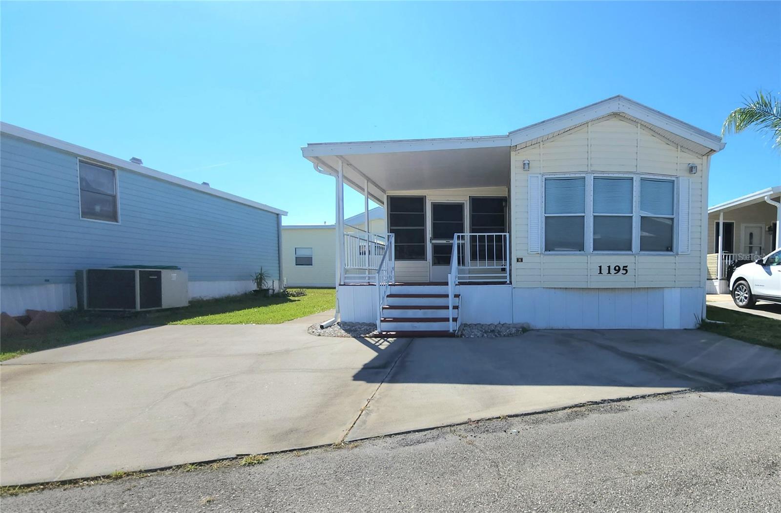 TWO BED, ONE BATH HOME IN ACTIVE 55+ COMMUNITY! This furnished property features an eat-in kitchen, all appliances included, a covered front porch as well as a large enclosed bonus room. The second bedroom has its own entrance, and a closet with washer and dryer. The main bedroom has an en suit bath with tub/shower. Central A/C. Membrane roofover. This property offers you the opportunity to update and make it your own. The community of Sugar Creek Country Club features two swimming pools, heated spa, tennis & pickleball, shuffleboard, fitness room, club house, workshop, and an active social calendar during the winter months. LOW HOA FEES of just $525 per quarter which include water, trash, sewer, basic cable, internet, and grass mowing. Enjoy this community's proximity to the Braden River and River Links Golf Course. Sorry this is not a dog lot.