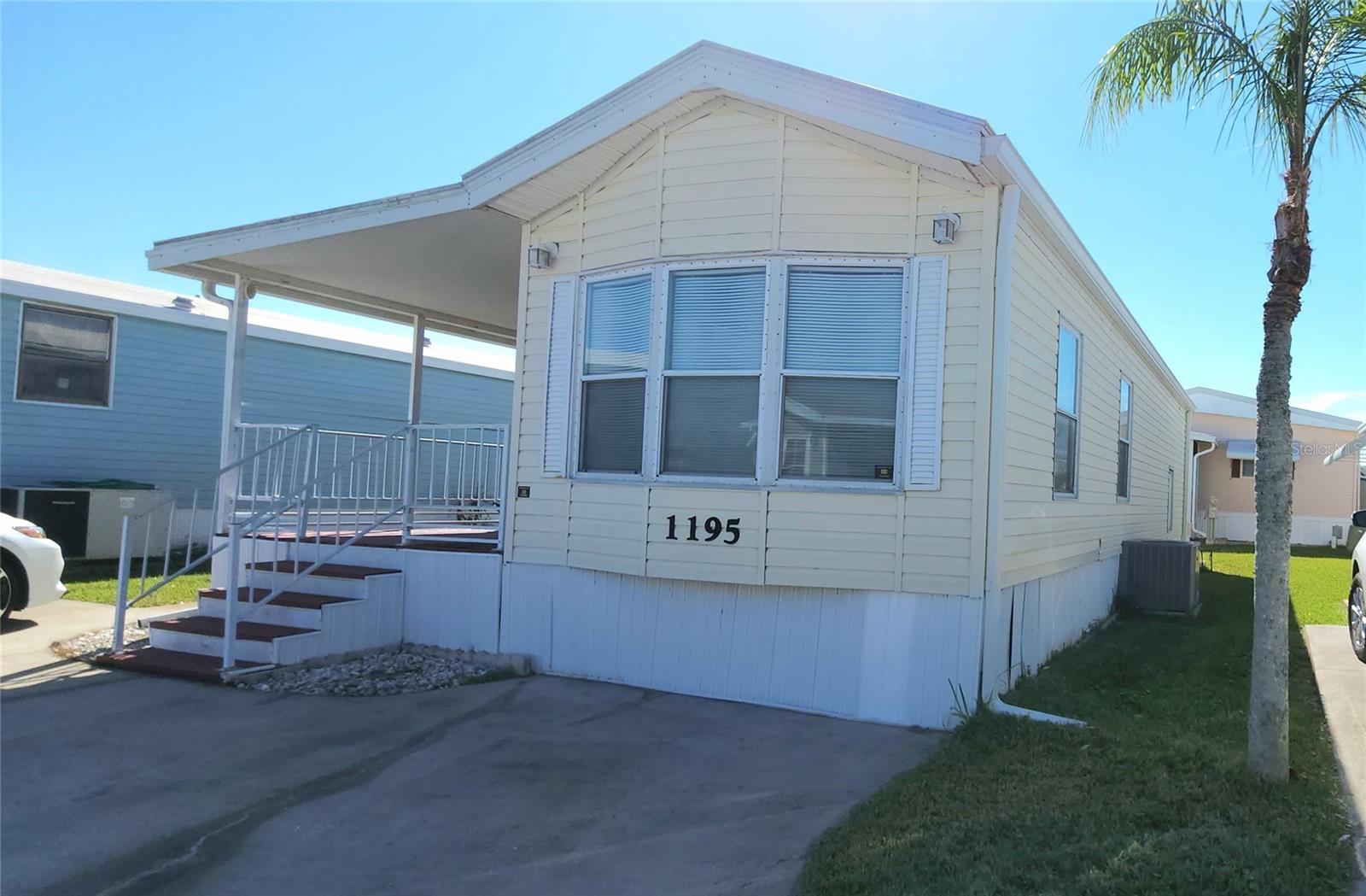 TWO BED, ONE BATH HOME IN ACTIVE 55+ COMMUNITY! This furnished property features an eat-in kitchen, all appliances included, a covered front porch as well as a large enclosed bonus room. The second bedroom has its own entrance, and a closet with washer and dryer. The main bedroom has an en suit bath with tub/shower. Central A/C. Membrane roofover. This property offers you the opportunity to update and make it your own. The community of Sugar Creek Country Club features two swimming pools, heated spa, tennis & pickleball, shuffleboard, fitness room, club house, workshop, and an active social calendar during the winter months. LOW HOA FEES of just $525 per quarter which include water, trash, sewer, basic cable, internet, and grass mowing. Enjoy this community's proximity to the Braden River and River Links Golf Course. Sorry this is not a dog lot.