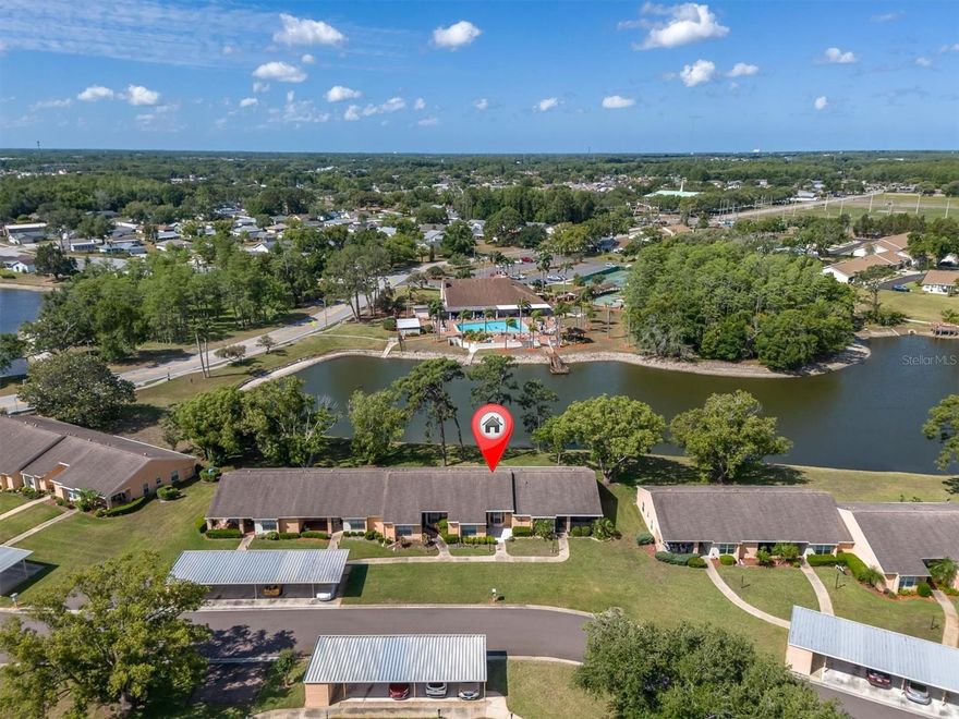 GOING, GOING GONE!   HURRY TO THIS 2/2/C LAKEFRONT VILLA IDEALLY LOCATED IN ONE OF TRINITY AREAS MOST POPULAR OVER 55 COMMUNITIES!  IT IS SO OPEN BRIGHT AND UPDATED!  THE SERENE VIEWS START AT THE FRONT DOOR!   THE GORGEOUS EAT IN KITCHEN SURROUNDS YOU YOU IN NEW CABINETS TOPPED BY GLEAMING GRANITE AND IS COMPLETE WITH ALL APPLIANCES AND A HANDY PANTRY!  LOVE THE VERSATILE GREAT ROOM STYLE FLOOR PLAN AND MORE OF THOSE WONDERFUL VIEWS!   THE PRIMARY BEDROOM IS A GENEROUS SIZE WITH A PRIVATE BATH AND WALK IN CLOSET AND.. MORE VIEWS! BEDROOM 2 IS CONVENIENTLY ADJACENT TO THE  UPDATED GUEST BATH!    THE ENCLOSED FLORIDA ROOM HAS THE BEST VIEWS! INSIDE LAUNDRY ROOM.  THE NEW LAMINATE FLOORING IS THRUGHOUT THE ENTIRE HOME.  JUST AROUND THE CORNER OR ACROSS THE LAKE IS THE CLUBHOUSE! IT FEATURES MORE ACTIVITIES THAN YOU WILL BE ABLE TO KEEP UP WITH!  HEATED POOL & SPA, TENNIS CTS, PICKLEBALL, BOCCE, POOL & BILLIARD ROOM, EXERCISE CLASSES, LIBRARY, CARD ROOM, DANCES, PARTIES AND MORE!  ADD ALL THIS IN WITH THE AMENITIES THE TRINITY LOCATION HAS AND YOU HAVE A FABULOUS VILLA AT A FABULOUS PRICE!  HESITATE.... AND YOU'LL BE TOO LATE!