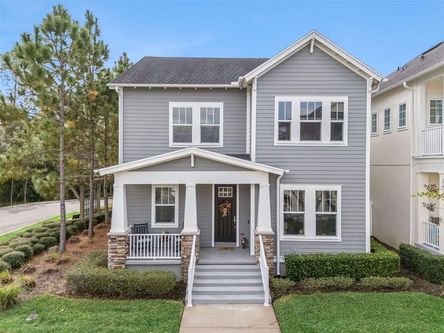 Enjoy the quintessential Celebration lifestyle in this beautifully appointed 3-bedroom, 2.5-bath “Tallulan” model by David Weekley Homes. Nestled in the charming Spring Lake Village, this residence is surrounded by tree-lined streets, serene trails, and peaceful lake and conservation views—all just a short stroll from vibrant downtown Celebration. From the moment you arrive, the curb appeal is undeniable. A welcoming covered front porch invites you to relax and soak in the charm of your new community. Step inside and you’ll be greeted by 10-foot ceilings, crown molding throughout the entire first floor, and 7¼-inch baseboards that elevate every space with timeless elegance. 
The heart of the home is the Gourmet Kitchen, thoughtfully designed with GE Monogram appliances (all except the refrigerator), expansive counters, and a layout perfect for both daily living and entertaining. The open-concept Great Room, dedicated Study/Den, and convenient powder room complete the main level, along with an extended two-car garage enhanced by a five-foot extension—a rare and valuable upgrade. A five-foot extension in Bedrooms 2 and 3 and an extended lanai further enhance the home’s livability, offering additional comfort and spaces to unwind. Upstairs, the bright and spacious Master Retreat features a large walk-in closet and a well-appointed bath with a large shower. Two additional bedrooms—each benefiting from the extended floor plan—share a full bathroom. The second-floor laundry room adds everyday convenience. Living in Celebration means enjoying an unparalleled lifestyle. This master-planned community offers parks, playgrounds, community pools, over 26 miles of walking and biking trails, nature preserves, and a calendar full of entertainment and dining options right in town. The HOA includes full lawn maintenance, giving you more time to enjoy it all. Centrally located near major highways (417, I-4, 429), Orlando International Airport, top-rated schools, and world-famous theme parks, this home truly has it all—style, comfort, and an unbeatable location.