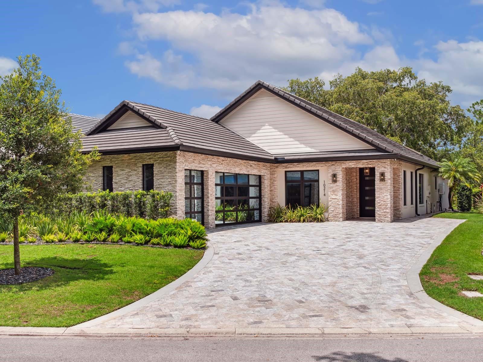 One or more photo(s) has been virtually staged. Tucked within an enclave of charming villas along Lake Nona’s golf practice facility and driving range, this completely remodeled single-story home, features excellent views and proximity to Lake Nona Golf & Country Club’s member amenities.
The property has been expertly reimagined from its dedicated entry foyer, offering the bedrooms and main living spaces privacy from the front door, to the expansive great room style living, dining and kitchen spaces.
With top-of-the-line appliances and elevated, imported finishes, including an Italian Marble backsplash, the eat-in kitchen is an entertainer’s dream, with two modern islands, and opens directly onto the dining area which enjoys views through the large outdoor living room.
The owner’s suite is positioned at the back of the home, to take full advantage of the property’s views, and is complete with a spa-like bath retreat and a generous owner’s closet.
The expanded outdoor entertainment area includes a covered lanai, outdoor fireplace, and patio seating set against mature landscaping for complete privacy and stunning golf views.
Additional features include a Temperature Controlled Wine Room, Dedicated Laundry with Drop Zone and a Three-Car Garage.