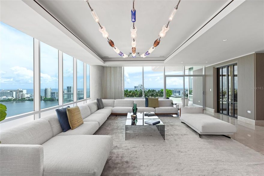 Step into unparalleled elegance with this stunning apartment in the prestigious and desirable Cosmopolitan building in San Juan. Boasting panoramic ocean and lagoon views, this home’s true showstopper is its sprawling outdoor terrace and private balcony, offering an idyllic space to relax or entertain while soaking in breathtaking scenery. Designed and decorated to perfection, every detail of this residence reflects exceptional taste, from the carefully curated finishes to the use of premium materials that elevate its sophistication.
Available immediately and move-in-ready. Whether you’re drawn by the exquisite design, the unmatched views, or the prime location, this apartment represents a rare opportunity to own a piece of San Juan’s most coveted real estate. Don’t wait—secure your private tour today. This unit has 4 assigned parking spaces and storage. The building offers unique amenities like 24/7 security an concierge services, emergency power generator, full gym, swimming pool, meeting room, clubhouse, visitors parking spaces, service elevator, private entrance, imposing and elegant lobby area and much more. HOA $2,432.73 (monthly), Property Taxes $10,754.66 (annually), Bare Wall Insurance $11,159,75 (annually).