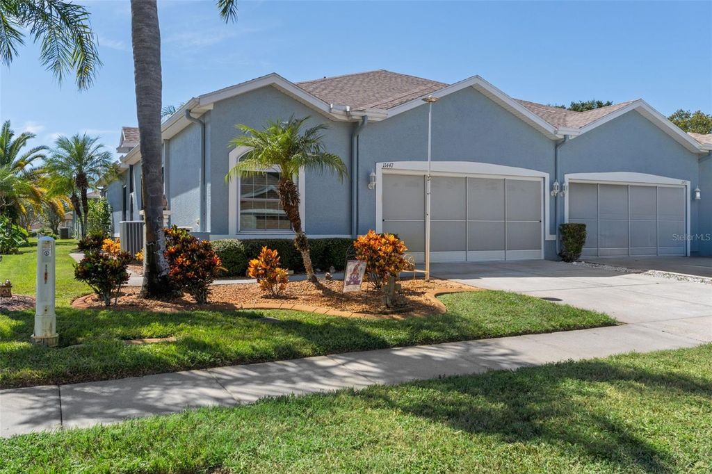 Photo of 11447 Golf Round Drive, New Port Richey, FL 34654 (MLS # TB8431418)