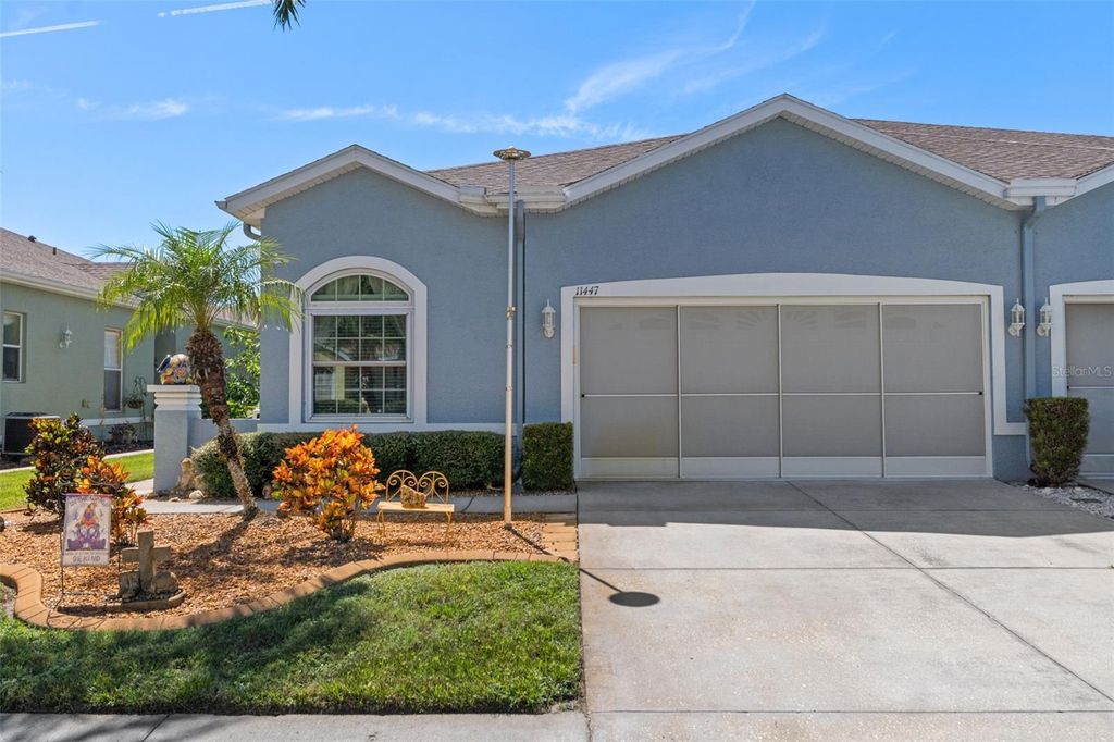 Photo of 11447 Golf Round Drive, New Port Richey, FL 34654 (MLS # TB8431418)
