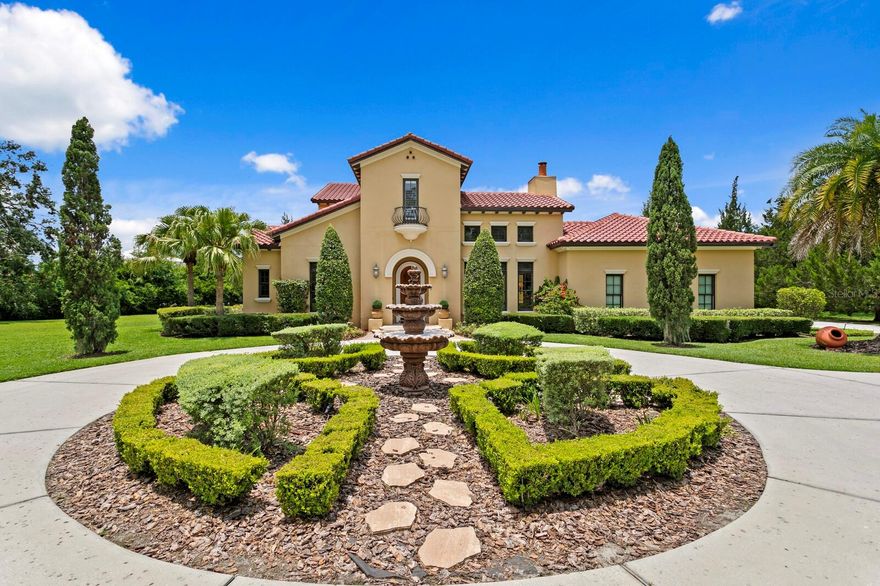 Escape to Stillwater… Life is serene, luxurious and surrounded by the sounds of nature. Presenting an opportunity to live expansively, privately, and beautifully—7713 Still Lakes Drive is in a gated community on private estate lot with option to add with an in-law suite for multi-generational living. Offering timeless design, modern comfort, and breathtaking natural surroundings this home is turnkey and move-in ready. Built in 2010, this custom-built home by Fechtel offers 5600 sq ft of total living space.  Set on 1.5 private acres, this estate is designed for both grand entertaining and everyday luxury. Key Features: • Seamless indoor /outdoor living with a unique atrium perfect for your morning coffee.  An an expansive covered patio and balcony overlooking the private grounds and pool just calling for your next large gathering.  A comfortable family room with 3 French doors opens seamlessly to the outdoor terrace. •Designer Kitchen with Butlers Pantry - A Gorgeous taupe and grey granite island anchors the space. Equipped with GE MONOGRAM appliances, the kitchen boasts a 6-burner gas range, double oven, microwave, two dishwashers, and an island with 2nd sink. The adjacent butler’s pantry with granite countertops and wine fridge flows into the formal dining room—ideal for gatherings large or small. • Primary Suite & Main-Level Bedroom – The main-level primary suite includes a sitting area, custom walk-in closet, and spa-inspired bath with freestanding tub and walk-in shower with views of foliage, bringing the nature inside. An additional ensuite bedroom, an office, and a living room with wood burning fireplace complete the thoughtful main floor. • Upstairs Living – Two oversized suites upstairs, each with private baths and walk-in closets—perfect for guests, teens, or multigenerational living. The upstairs entertainment zone includes a study nook with built-in desk, a Bonus room with wet bar and fridge, and an expansive balcony overlooking the serene pool and extended private back yard. • Two additional flex rooms could be used as additional bedrooms or 2nd office and exercise room • Resort-Style Outdoor Living – Heated infinity pool and spa, gas fire pit, stone pavers , archway covered terrace, full summer kitchen, and a separate full pool bath. Lush gardens and mature landscaping give this estate privacy. The extended yard beyond the pool is perfect for kids, pets or the addition of an in-law suite.  • Additional Highlights –NEW roof 2025,  Features soaring ceilings with exposed wood beams, archway entrances, 5 full bathrooms and 2 1/2 bathrooms, oversized side entry 3-car garage, a laundry chute, custom-finished walk-in closets, two fountains, and an outdoor atrium at the heart of the home• Stillwater is protected with 24hr guard-gated security.  This estate is more than a home—it’s a retreat. Unwind in complete privacy and enjoy the serenity of expansive natural surroundings. Located in the heart of Odessa—one of the Tampa Bay area’s most sought-after communities for its natural beauty, larger homesites, and tranquil lifestyle—you’ll enjoy the peace of country-style living with the convenience of being just minutes from top-rated schools (Steinbrenner district), hospitals, dining, shopping, major highways, and Tampa International Airport. It’s the perfect balance of space, serenity, and accessibility.