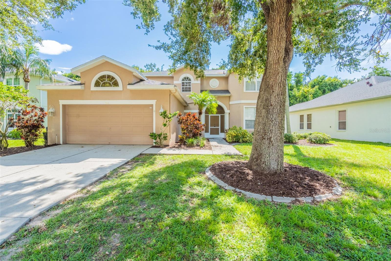 One or more photo(s) has been virtually staged. Spacious and well-appointed 2-story home featuring 4 bedrooms and 3.5 bathrooms with an inviting open floor plan. The main level offers a welcoming foyer and a primary suite with a large walk-in closet, separate tub and shower, and a dual vanity. The kitchen includes a convenient bar that opens to the living and dining areas—perfect for entertaining. Enjoy outdoor living on the screened back porch overlooking the backyard. A 2-car garage provides plenty of storage and parking space.One or more photo(s) has been virtually staged. Schedule a showing today!