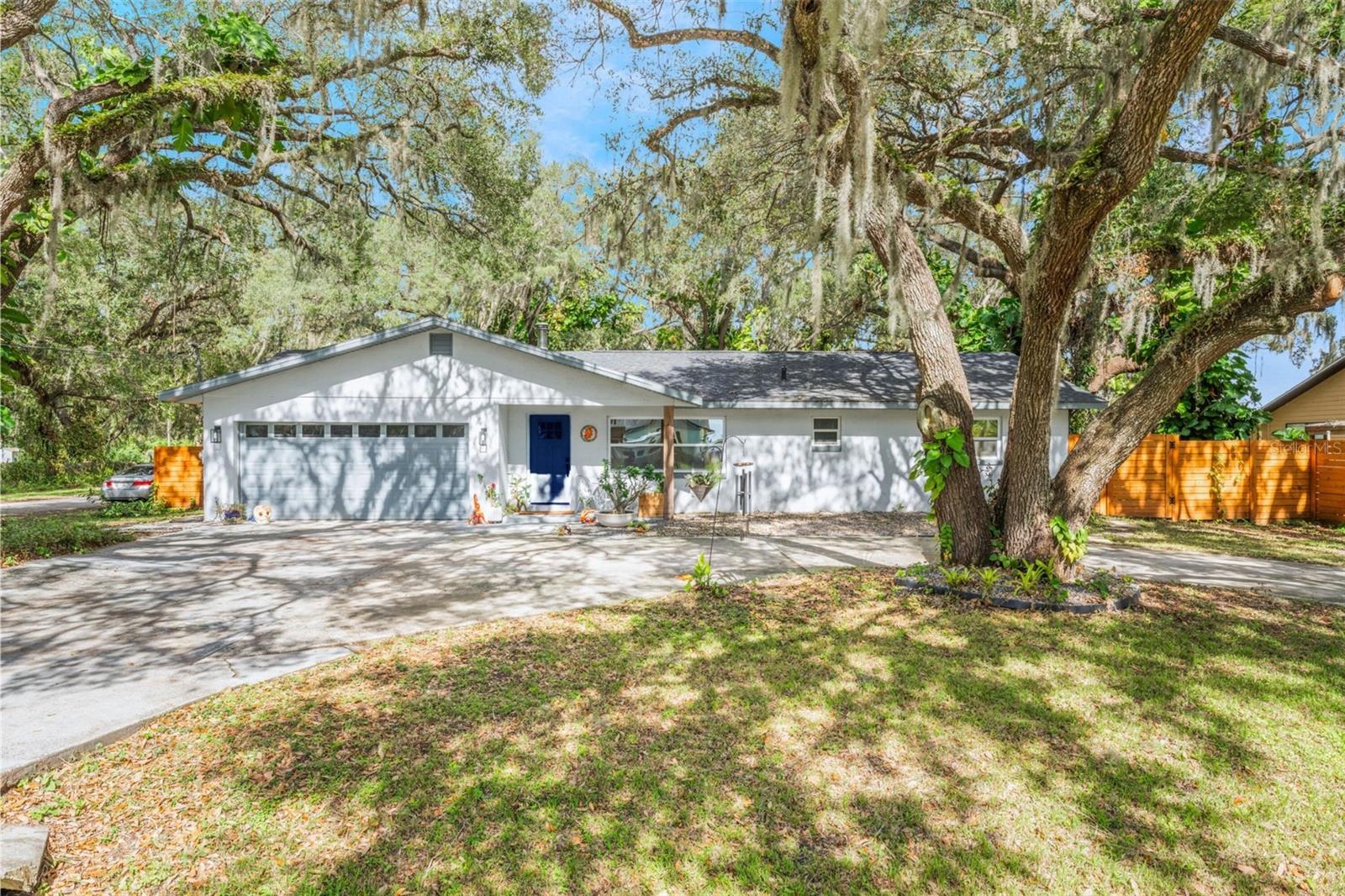 Your dream LAKEFRONT POOL HOME in on the market! Fully remodeled, move-in ready, and best of all... NO HOA! This stunning 4 Bed, 3 Bath gem has been completely transformed inside and out, giving you the peace of mind and modern comforts you’ve been waiting for. From the moment you arrive, you’ll notice the upgrades that matter: a NEWER ROOF, WINDOWS, FRESH INTERIOR PAINT, and even a NEWER WELL PUMP and SEPTIC TANK, all done for you! Step inside to enjoy the glow of NEW LIGHT FIXTURES, and LUXURY VINYL FLOORING all throughout, and a NEW A/C SYSTEM that keeps everything cool and energy efficient especially during the hot Florida months.
The heart of the home is the grand open-concept kitchen and living area, perfect for entertaining or enjoying quiet evenings at home. The gourmet kitchen is a showstopper, with GREY SHAKER STYLE CABINETS, QUARTZ COUNTERTOPS, GLASS HERRINGBONE BACKSPLASH, and a statement farm style sink. You'll love the custom island, stainless steel appliances, and designer over-the-range hood. The formal dining room, complete with a chandelier, flows seamlessly to your spacious backyard through sleek sliding glass doors. Picture weekends spent lounging by your incredible scenic pool and peaceful garden or enjoying the view of the lake up front with a coffee on hand. Retreat to your private primary bedroom wing, featuring ceiling fans, wooden accent ceiling beams, a view to beautiful pool, and a walk-in closet or relax in your newly updated ensuite bathroom! Every room AND Bedroom in this home has been refreshed to offer style, space, and functionality. Whether you're starting your next chapter or investing in a standout property, this home checks every box.
Come see it today, homes like this don’t come around often!