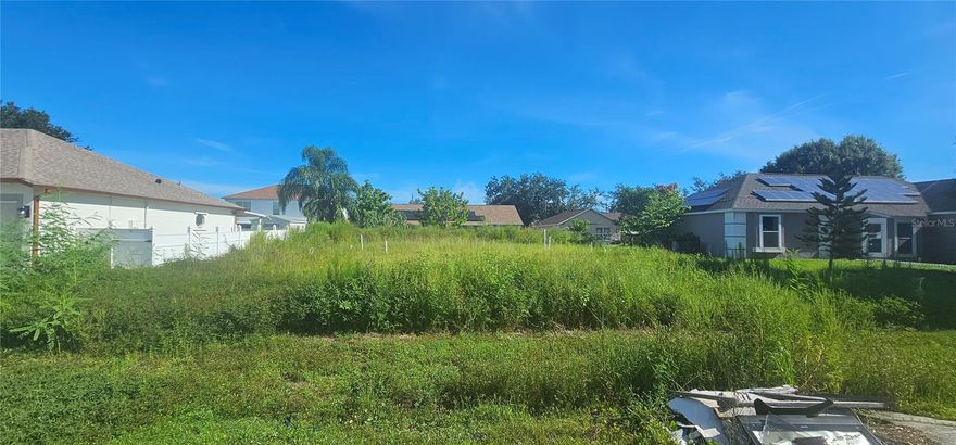 A remarkable advantage is that all impact fees have already been paid, saving you thousands and allowing you to start construction immediately. Excellent opportunity to build your dream home in the growing community of Poinciana Village 2 in Kissimmee, Florida. This 7,700 sq. ft. residential lot (0.17 acres) offers an ideal location surrounded by modern homes, parks, and convenient access to shopping, schools, and major highways leading to Orlando and world-class attractions. The property is zoned residential, not in a flood zone, and ready for development. The seller can also share the architectural plans of a beautiful home previously designed for the lot, providing inspiration and a head start for your project. Whether you’re an investor or a homeowner, this ready-to-build lot represents a smart and valuable opportunity in one of Central Florida’s most promising areas.