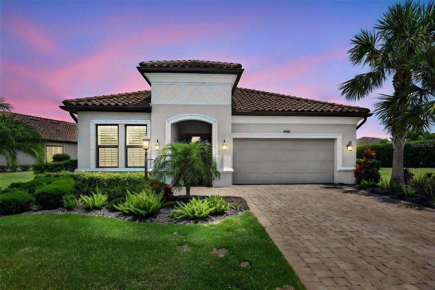Welcome to an exceptional turnkey residence in the highly sought-after Esplanade Golf & Country Club, perfectly positioned on the 12th tee box with stunning golf course views that create a breathtaking backdrop for everyday living. This deeded golf property offers the ultimate in luxury and lifestyle.
This beautifully appointed 2-bedroom + den, 2.5 bath home showcases refined design and thoughtful upgrades throughout. From the moment you arrive, the custom glass front door sets the tone for the elegant interior, featuring tray ceilings, crown molding, and an open-concept layout designed for both comfort and entertaining.
The chef’s kitchen is a true centerpiece, complete with a designer backsplash, oversized island with additional storage, pull-out shelving in all base cabinets, and a spacious butler pantry offering abundant prep space. A custom-built wine display accommodating up to 30 bottles adds a sophisticated touch.
The versatile den/office is enhanced with built-ins, closet space, and a Murphy bed with twin beds, and could easily function as a third bedroom for added flexibility. The primary suite offers a private retreat with a custom closet featuring a locking jewelry drawer and convenient laundry room access.
Seamless indoor-outdoor living is achieved through corner pocket sliding doors that open to an expansive lanai finished with travertine flooring. The outdoor space is designed to impress, featuring an oversized island with built-in speakers, a summer kitchen with gas griddle, and a natural gas firepit table. Enjoy the saltwater pool with color-changing LED lighting, pop-up cleaning system, auto-fill, and a new pool heater and pump (2025). Croci hurricane impact shutters and privacy wind screens provide both comfort and peace of mind.
Additional highlights include plantation shutters, ADT security system, Ring doorbell, water sensors throughout, and a garage equipped with epoxy flooring and an electric overhead storage rack.
Experience the ultimate in amenity-rich, resort-style living in one of Lakewood Ranch’s premier communities, offering golf, dining, wellness, and an unparalleled lifestyle.

Living in Esplanade is like being on vacation every day. The community is built around healthy living and living well with unlimited exercise and social options. Esplanade offers a wide array of amenities and activities such as an 18-hole championship golf course, two resort pools, hot tubs, resistance pool, pickleball, tennis, bocce ball, two fitness centers, exercise classes, two dog parks, playground, firepit, spa/salon, an on-site lifestyle director, social events, and various clubs. The state-of-the-art Culinary Center offers residents several dining options such as the Barrel House Bistro, Bahama Bar, as well as catering services, wine tastings, and special events. Esplanade is located in the heart of Lakewood Ranch, close to I-75, Lakewood Ranch Main St., University Town Center, Sarasota Polo Club, shopping, dining, entertainment, hospitals, cultural attractions, boating, parks, and Florida’s famous sandy beaches.