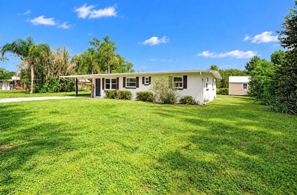 Photo of 717 W Deer Lake Drive, Lutz, FL 33548 (MLS # TB8552458)