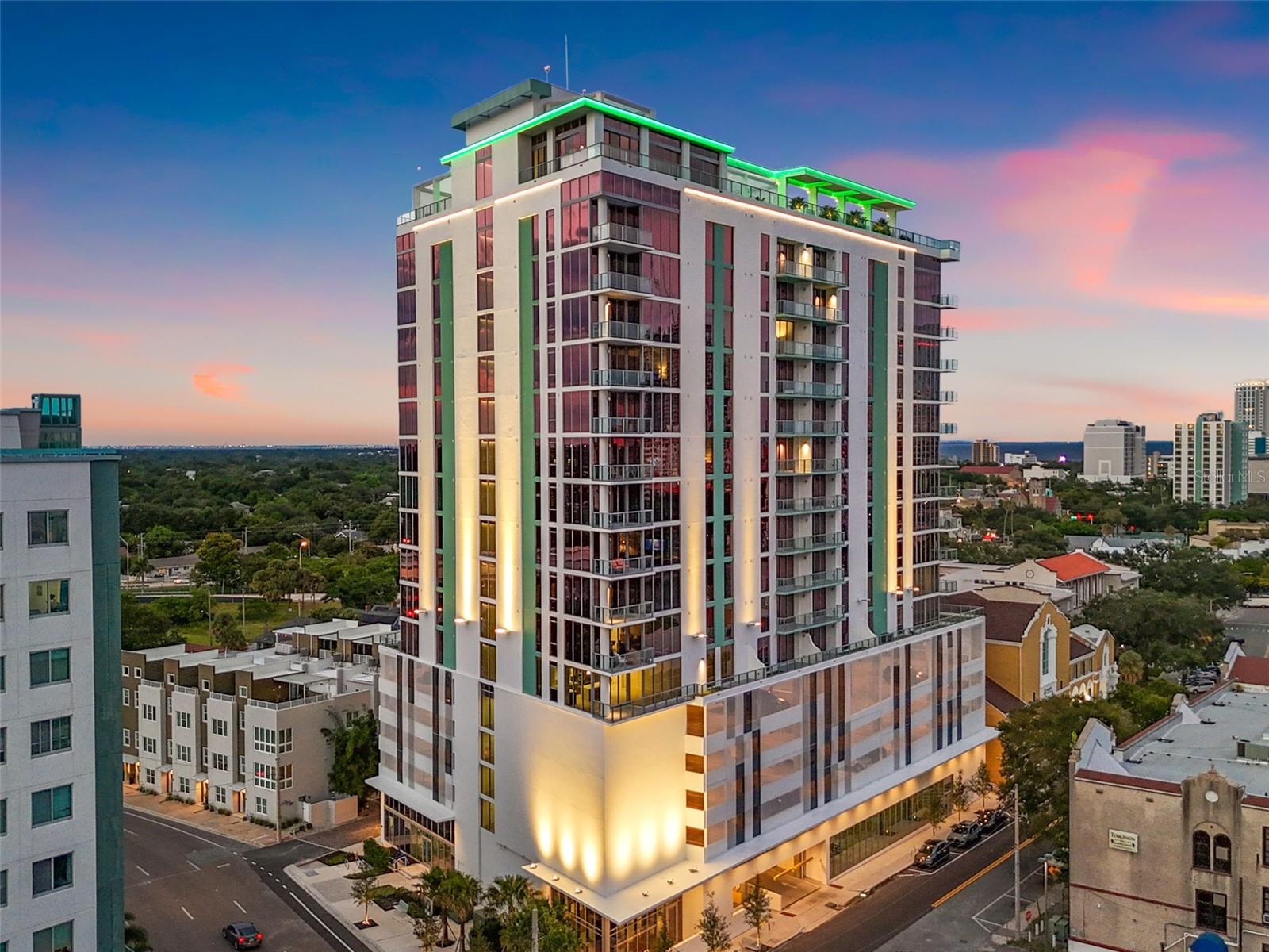 Come see why the Opal floorplan was the first to sell out pre-construction! Welcome to Unit 806 at Reflection - a stunning oversized 1 bedroom, 1.5 bathroom + a den with over 1,550 square feet of thoughtfully designed interior space, plus over 100 sq ft terrace for soaking in Mirror Lake and city views! This unit is also one of the only Opals that comes with TWO side-by-side parking spaces located on Level 5 of the parking garage. Larger than most two-bedroom condos downtown, this plan gives you so many options. 9.5' ceilings, floor-to-ceiling windows and porcelain tiles floor greet you upon entrance. The kitchen is top tier with a waterfall-edge quartz island, Bosch panel-ready appliances and loads of storage! The private owner's suite is incredibly lavish featuring motorized blackout shades in the bedroom, luxe bathroom featuring seamless walk-in shower with dual shower heads and sprayers and a dream custom closet recently completed by Closet Envy. Need a flexible second space? There are two options! The large den off the hallway could easily transform into a guest room, home office or studio and there is even a nook leading into the laundry room that's perfect for a secondary workspace. As a resident, you get exclusive access to the iconic 12,000 square foot rooftop and 18th floor amenities including the heated saltwater pool, hot tub, fitness center, sauna, outdoor kitchen and wet bar, resident social club, panoramic views of the city and bay plus a golf cart shuttle service! The building also features hospital-grade air filtration, water softening and secure, touchless entry. Tucked into the peaceful Mirror Lake neighborhood but just a few blocks from Central Ave, this location gives you the best of both worlds — city energy and neighborhood charm. If you’ve been waiting for something special, this is it.